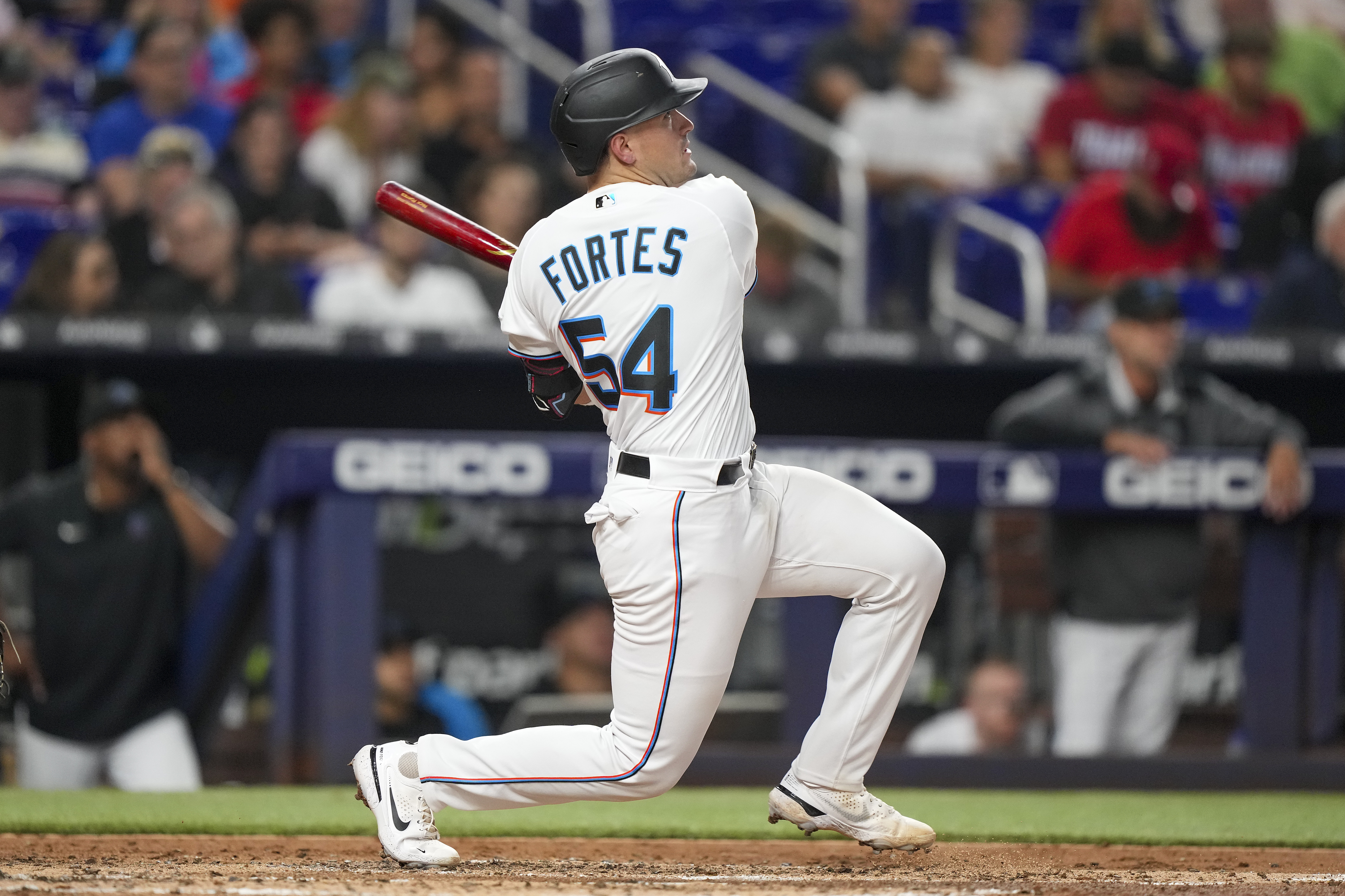 Nick Fortes #54 of the Miami Marlins hits a home run in the third inning against the San Diego Padres at loanDepot park on August 16, 2022 in Miami, Florida.