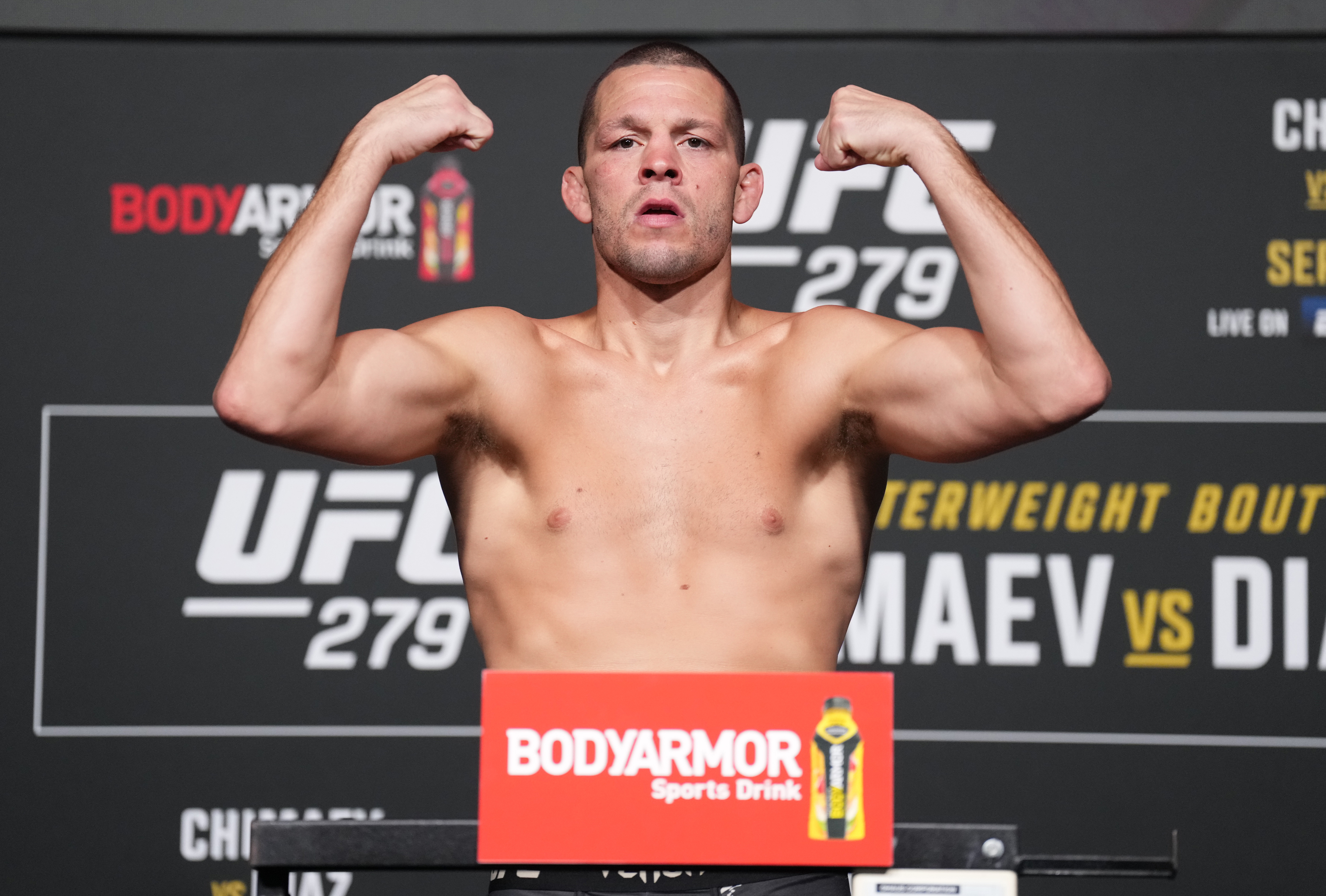 Nate Diaz poses on the scale during the UFC 279 official weigh-in at UFC APEX on September 09, 2022 in Las Vegas, Nevada.