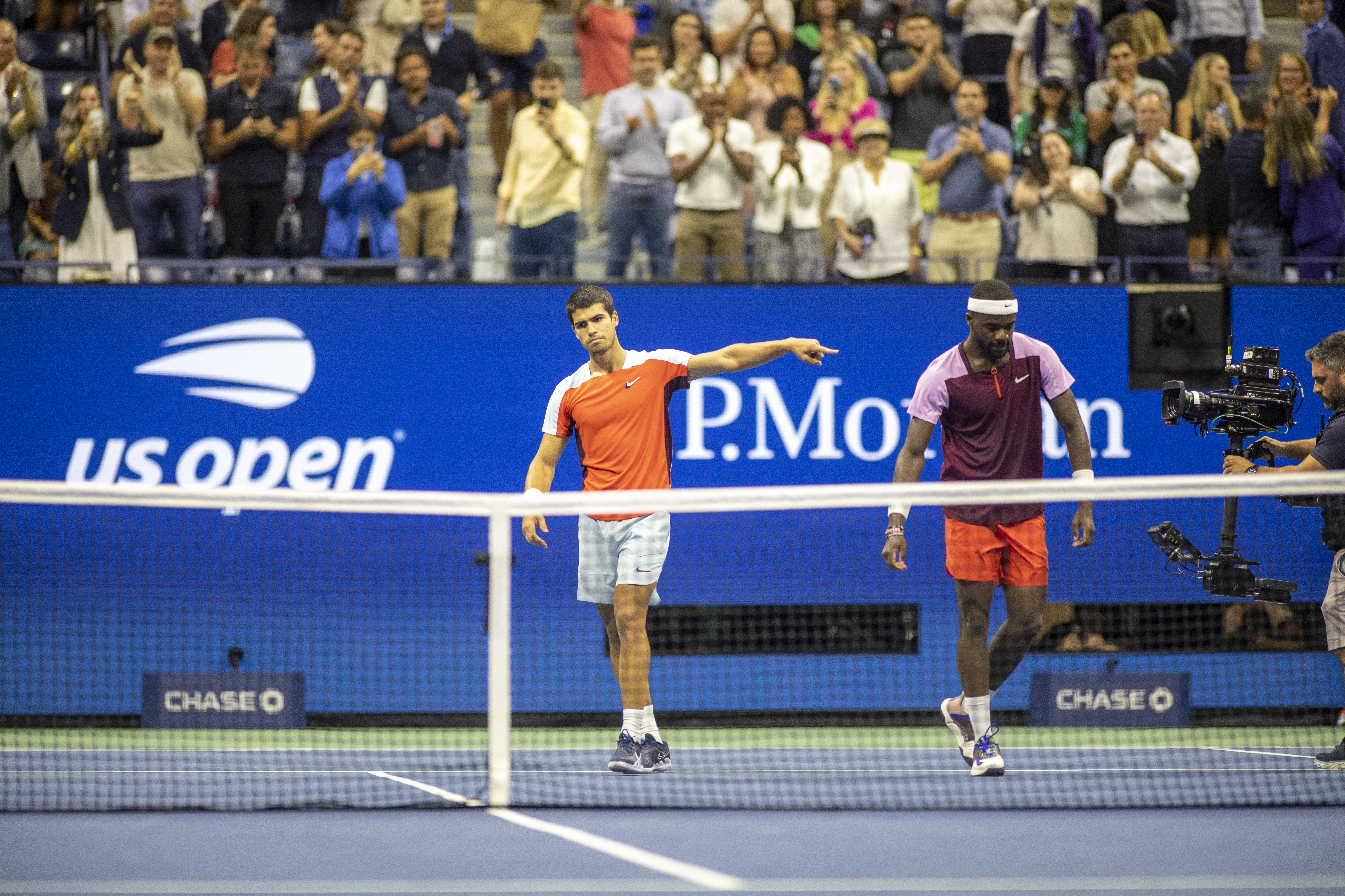 Winner Carlos Alcaraz of Spain points to Frances Tiafoe of the United States in appreciation after their five-set marathon in their Men’s Singles Semi-Final match on Arthur Ashe Stadium during the US Open Tennis Championship 2022 at the USTA National Tennis Centre on September 9th 2022 in Flushing, Queens, New York City.