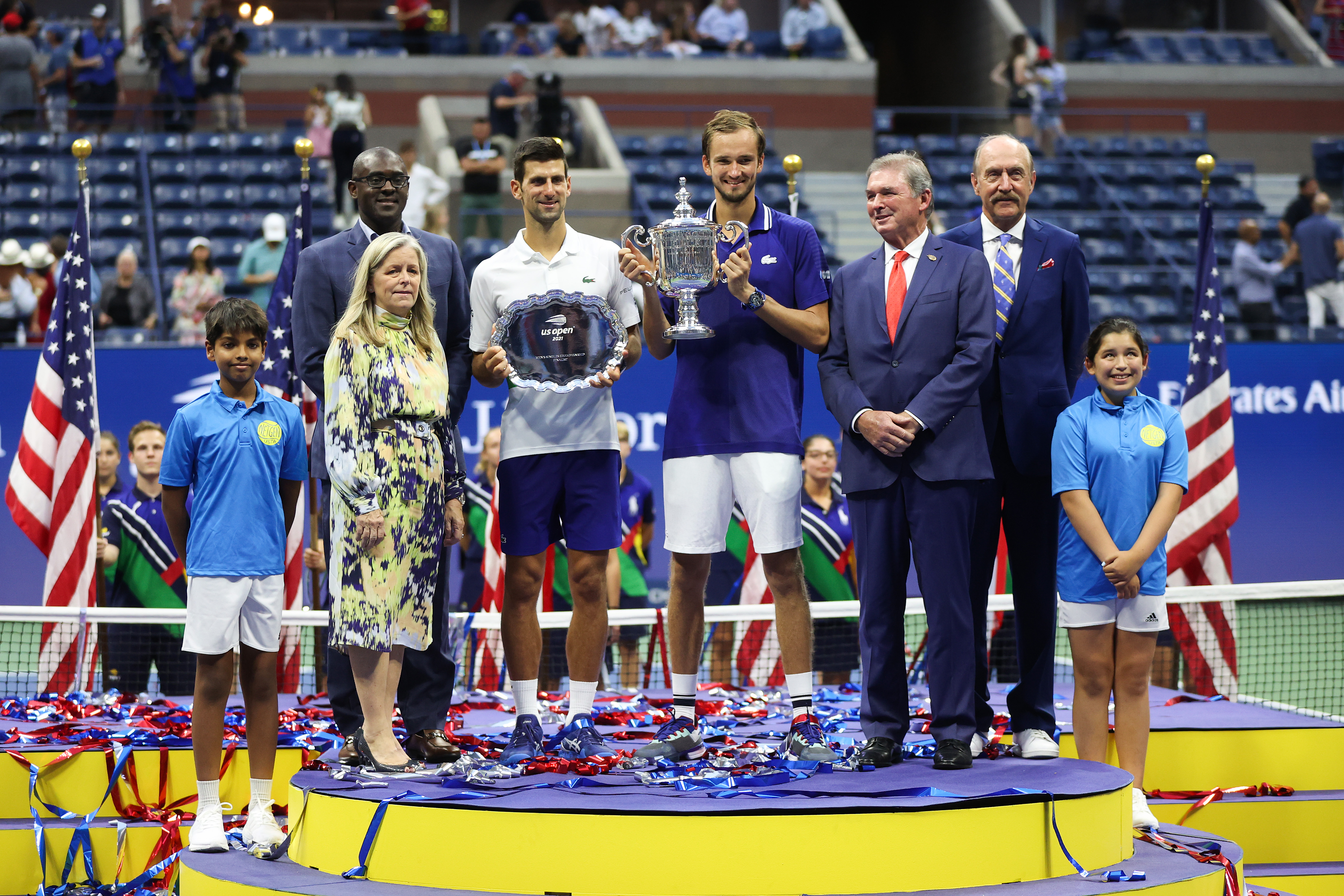 Novak Djokovic of Serbia holds the runner-up trophy alongside Daniil Medvedev of Russia who celebrates with the championship trophy after winning their Men’s Singles final match on Day Fourteen of the 2021 US Open at the USTA Billie Jean King National Tennis Center on September 12, 2021 in the Flushing neighborhood of the Queens borough of New York City.