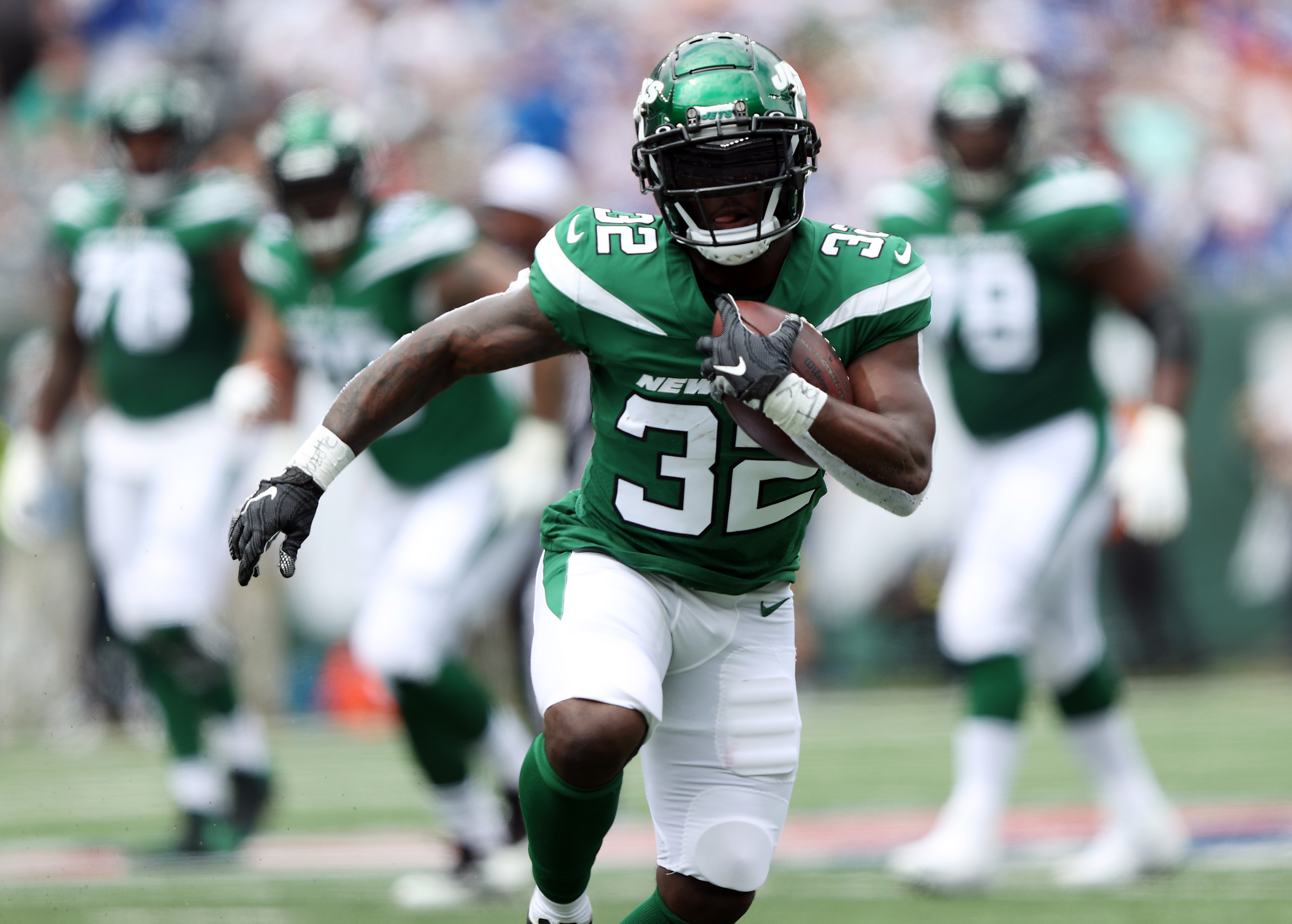 Running back Michael Carter #32 of the New York Jets carries the ball during the 1st half of the preseason game against the New York Giants at MetLife Stadium on August 28, 2022 in East Rutherford, New Jersey.