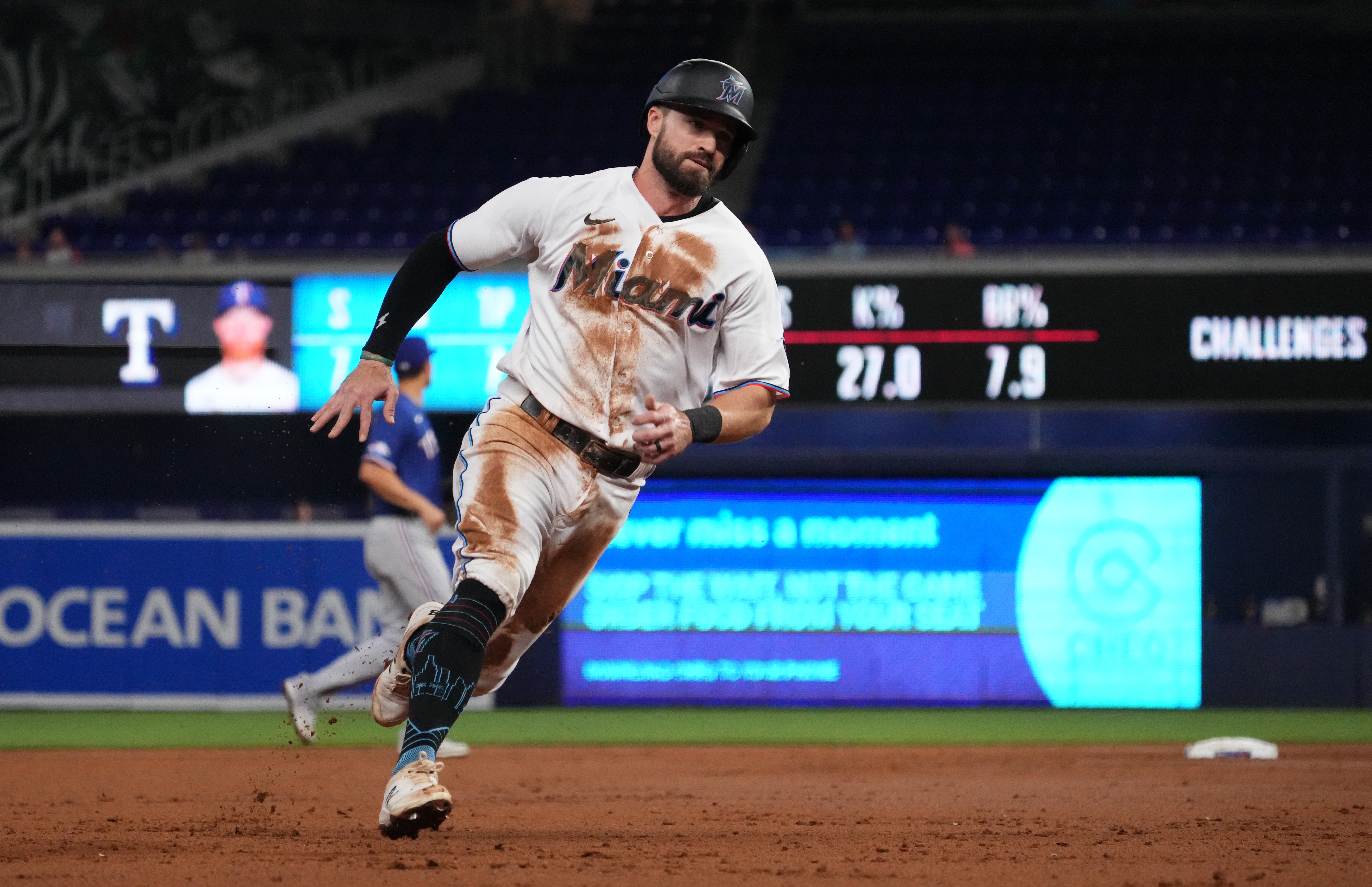 Miami Marlins third baseman Jon Berti (5) rounds third base to score a run in the first inning against the Texas Rangers at loanDepot park.