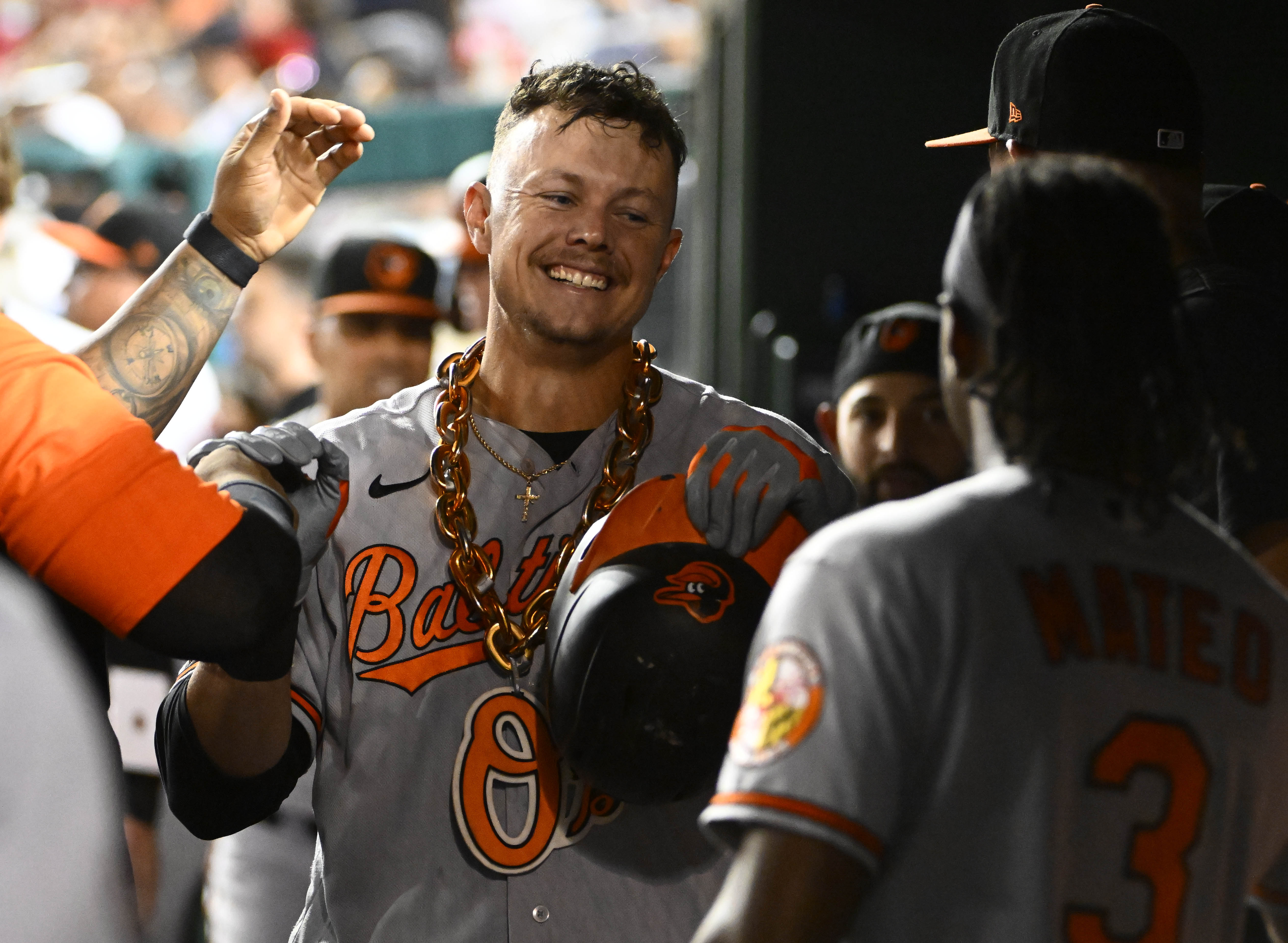 Ryan Mountcastle of the Baltimore Orioles celebrates in the dugout after hitting a game-tying home run