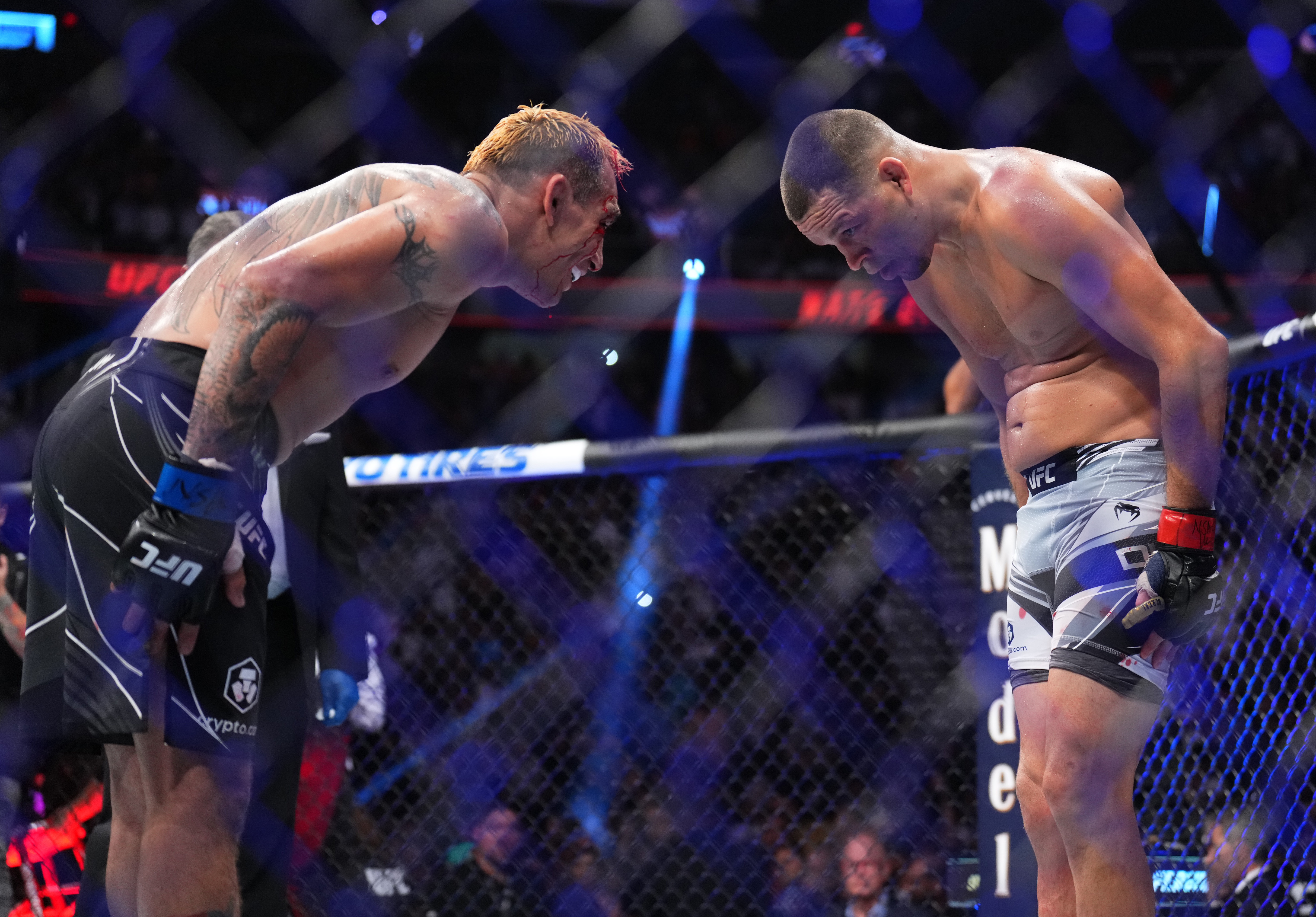 Nate Diaz and Tony Ferguson bow at each other after their UFC 279 headliner.