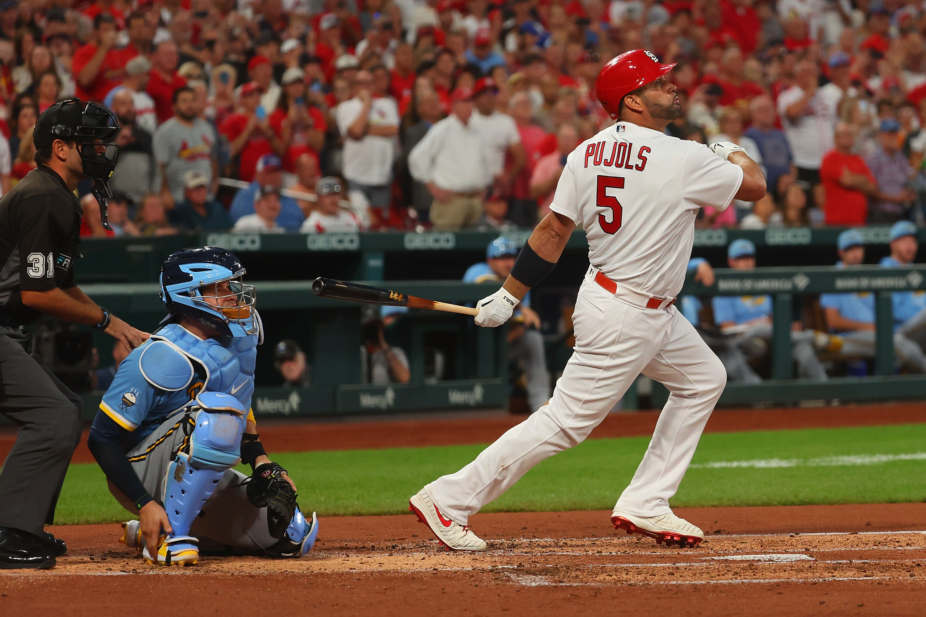 Albert Pujols #5 of the St. Louis Cardinals drives in a run with a single against the Milwaukee Brewers in the first inning at Busch Stadium on September 13, 2022 in St Louis, Missouri.