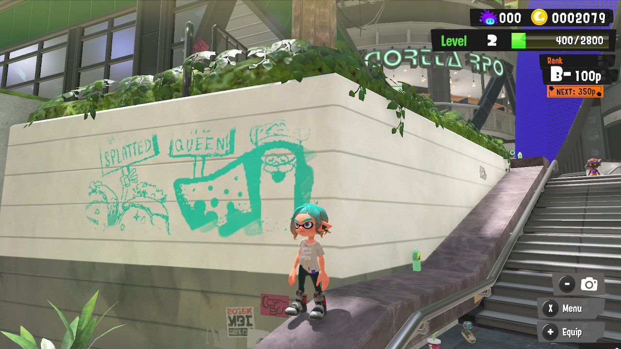 The player stands in front of a wall posting in Splatoon 3