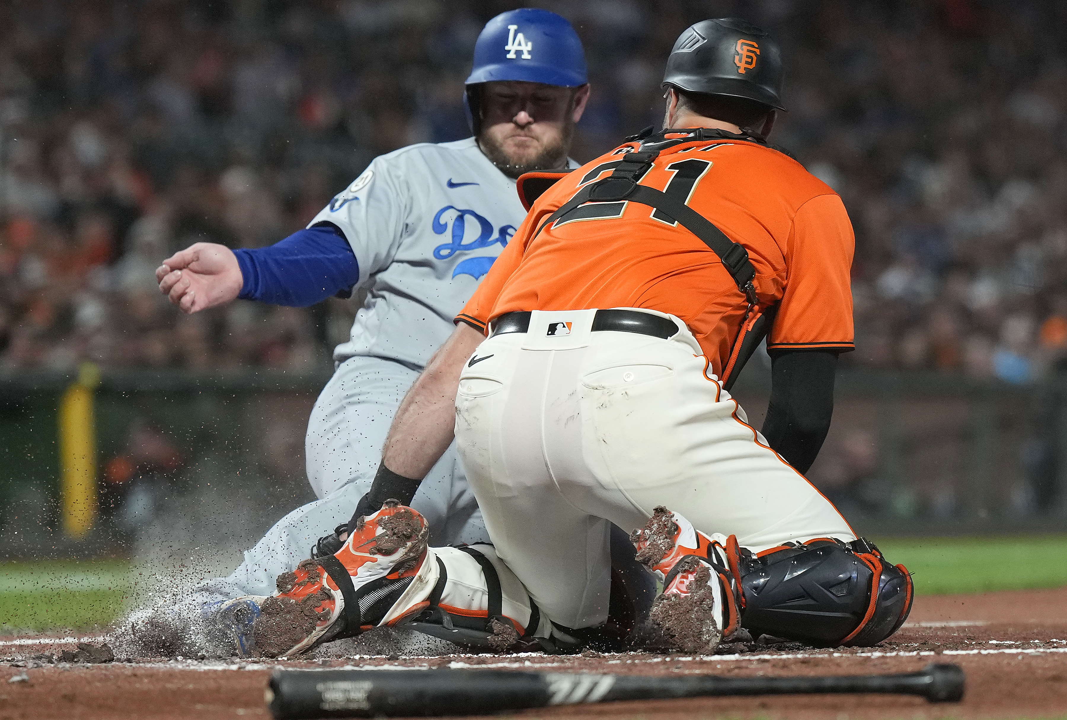 Joey Bart trying to tag Max Muncy at home plate