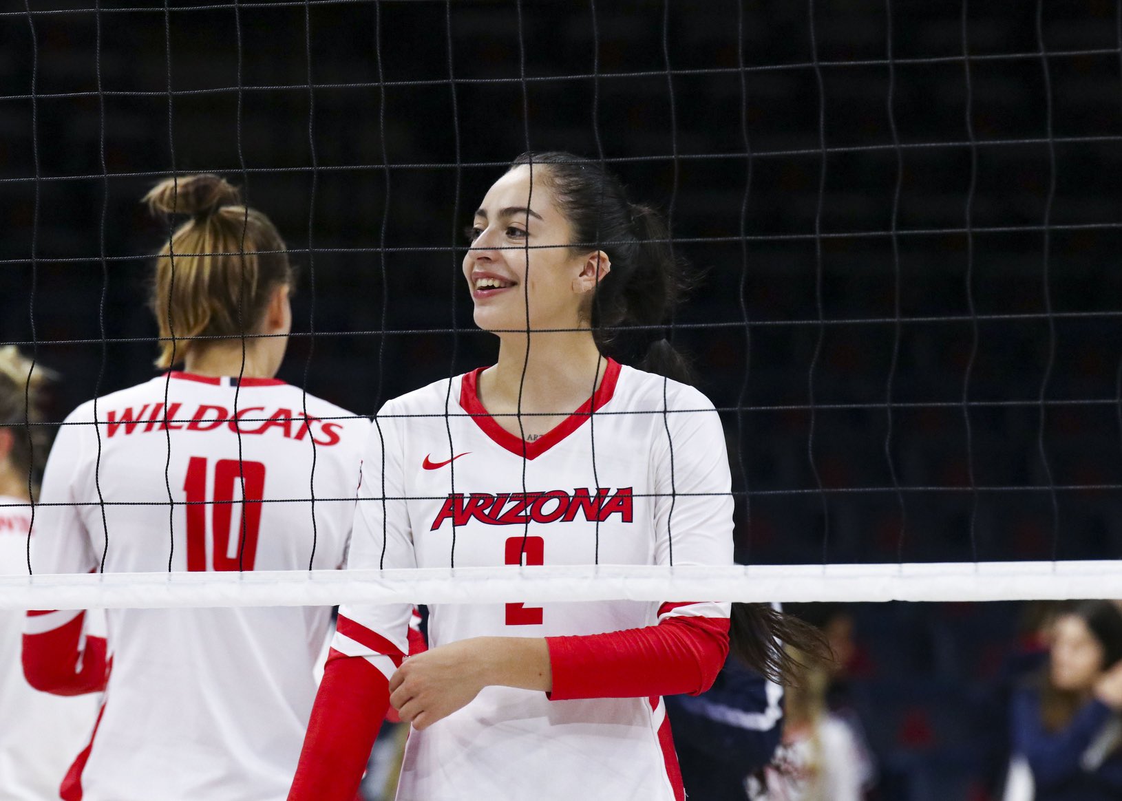 Arizona volleyball player Sofia Maldonado Diaz faces the camera and teammate Puk Stubbe faces away from the camera