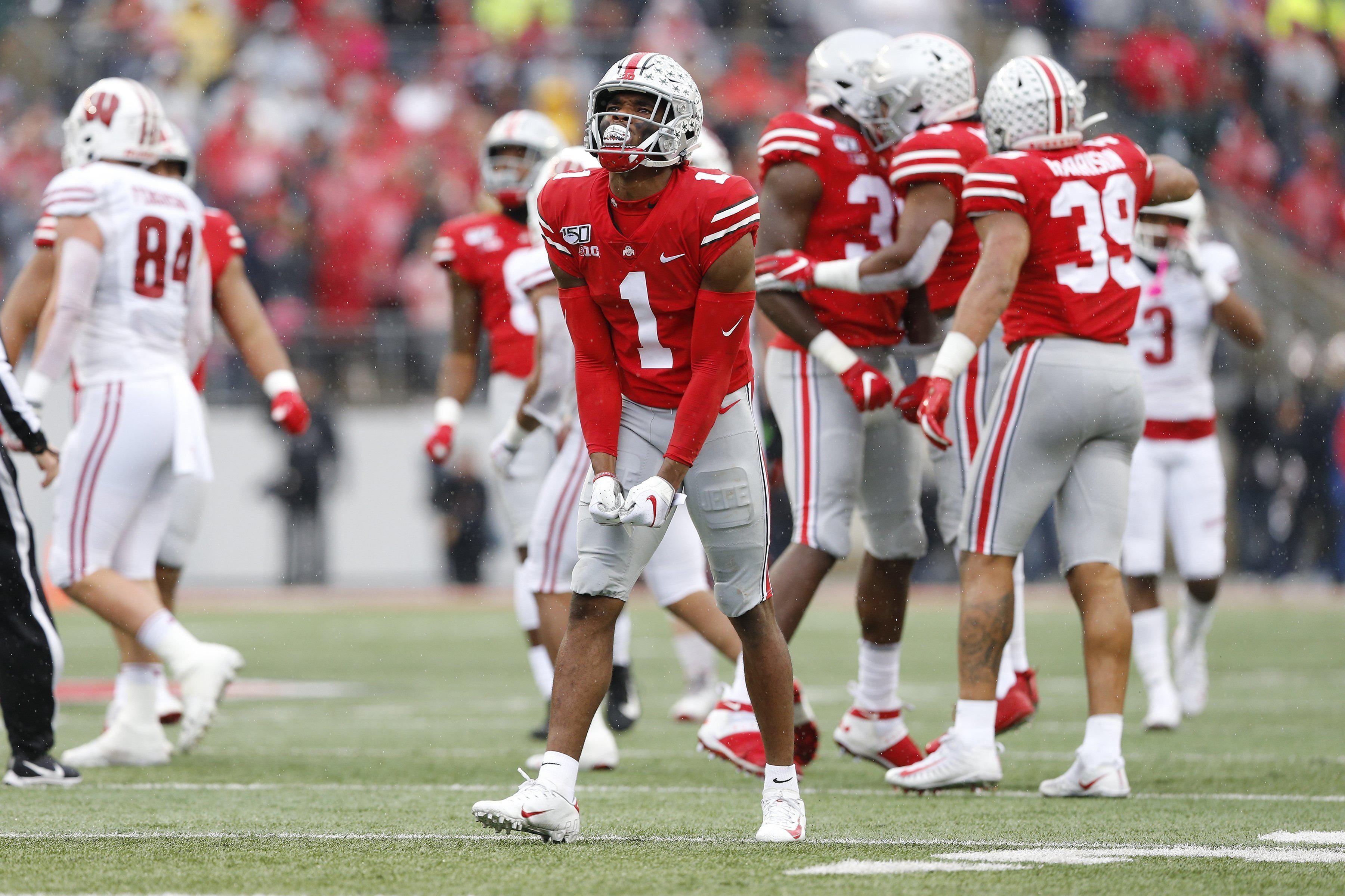 Ohio State Buckeyes cornerback Jeff Okudah celebrates a third down stop during the second quarter of the NCAA football game against the Wisconsin Badgers.