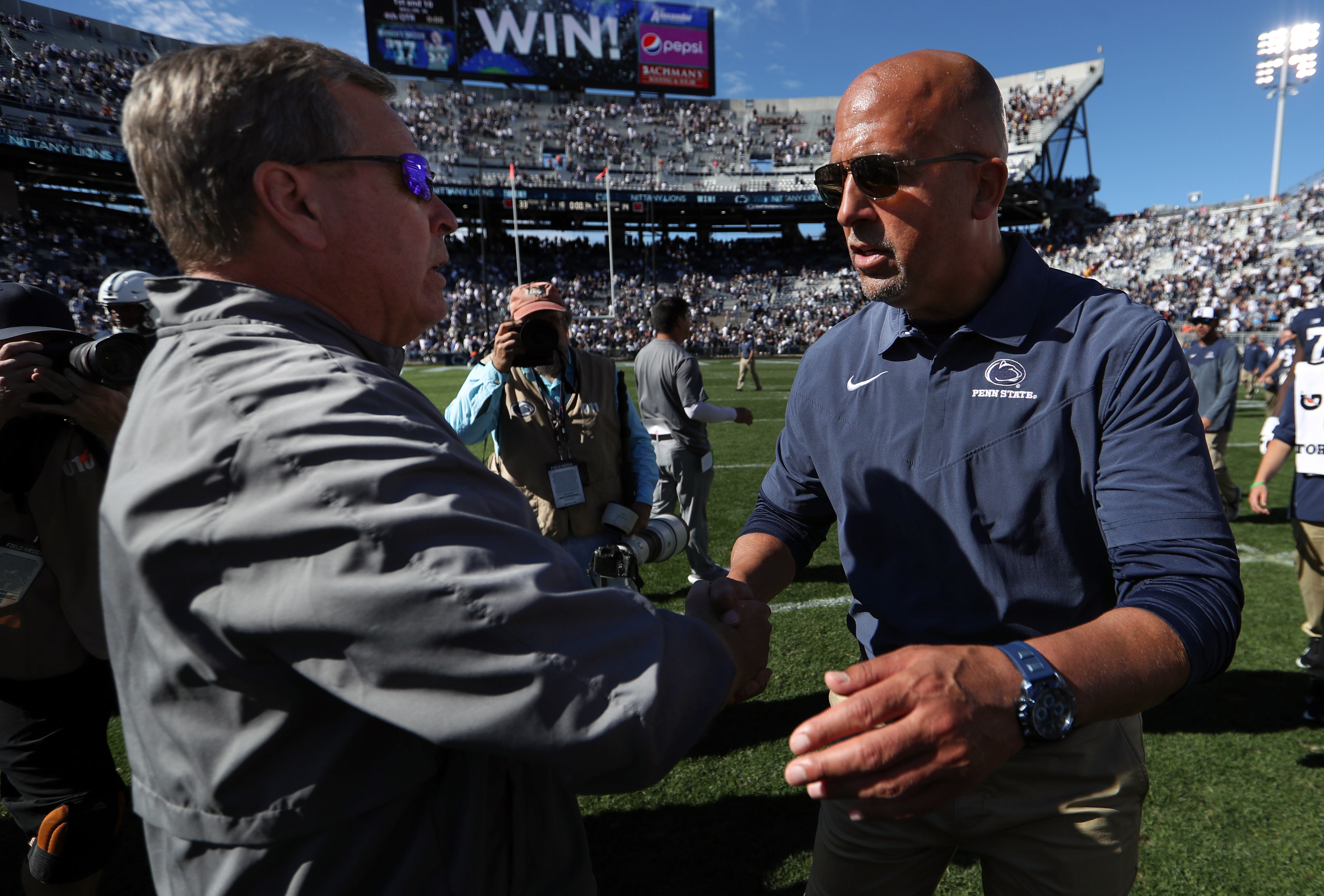 Sep 24, 2022; University Park, Pennsylvania, USA; Penn State Nittany Lions head coach James Franklin (right) shakes hands with Central Michigan Chippewas head coach Jim McElwain (left) following the competition of the game at Beaver Stadium.
