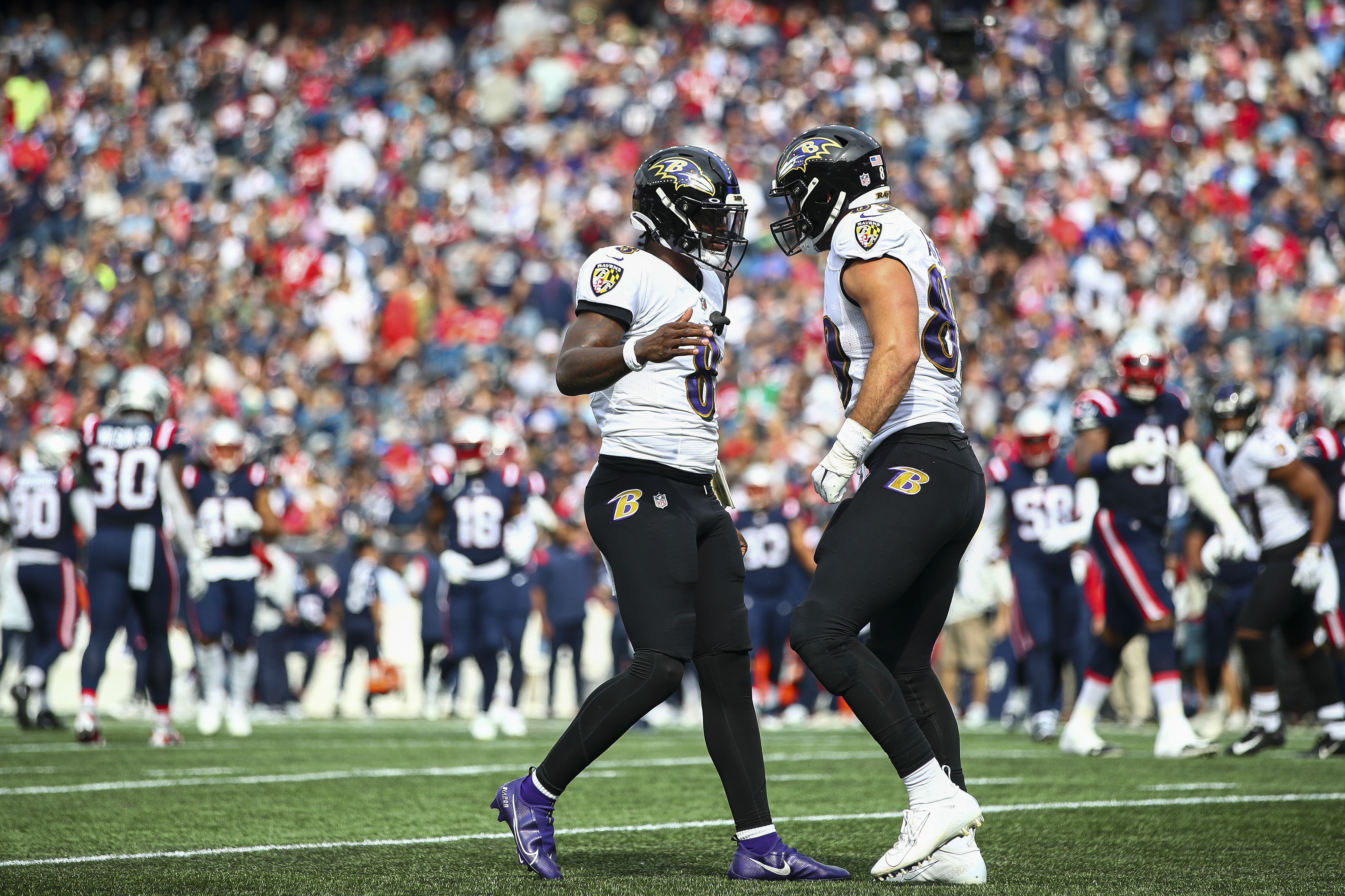 Quarterback Lamar Jackson #8 of the Baltimore Ravens celebrates with tight end Mark Andrews #89 of the Baltimore Ravens after Andrews’ touchdown during the second quarter against the New England Patriots at Gillette Stadium on September 25, 2022 in Foxborough, Massachusetts.