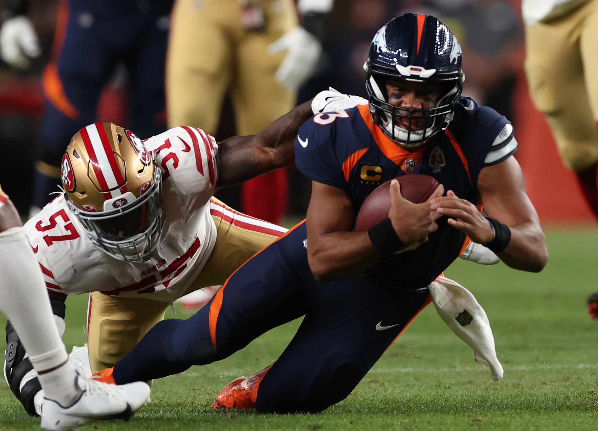 Russell Wilson #3 of the Denver Broncos rushes during the first half against the San Francisco 49ers at Empower Field At Mile High on September 25, 2022 in Denver, Colorado.