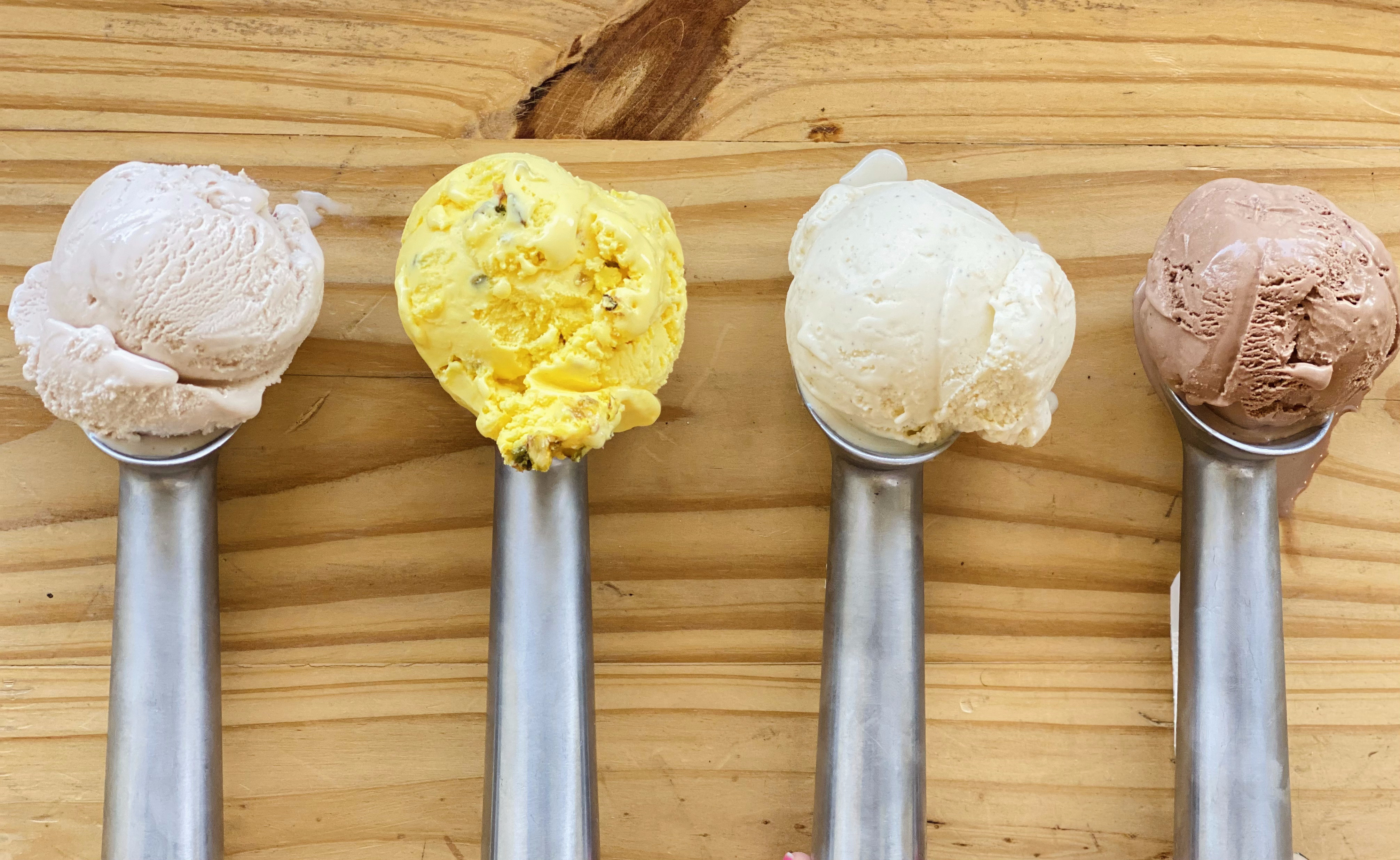Four scoops of Craft Creamery ice cream, including brisket, Bastani, pho, and chocolate.