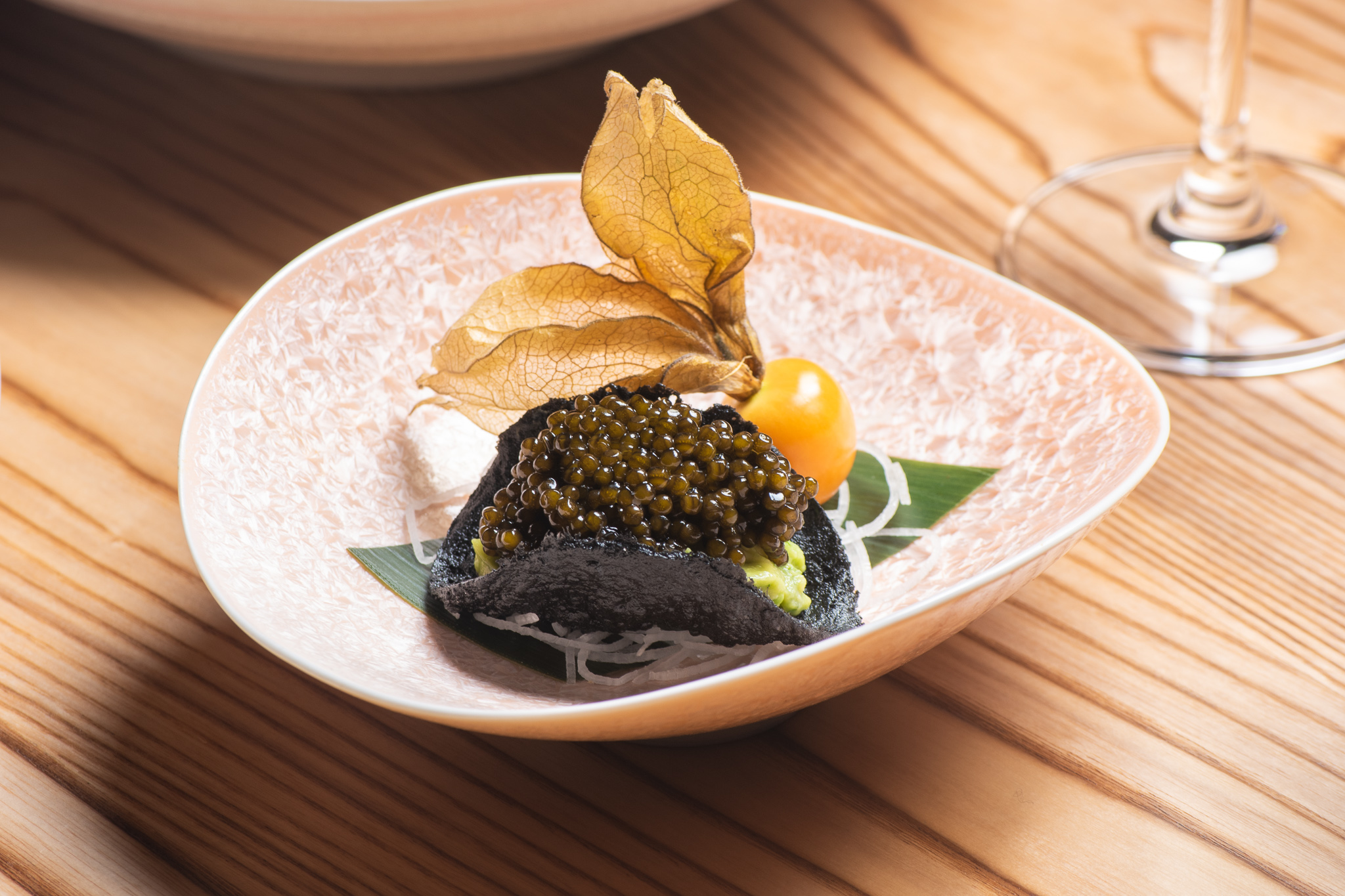 A nori taco filled with caviar.