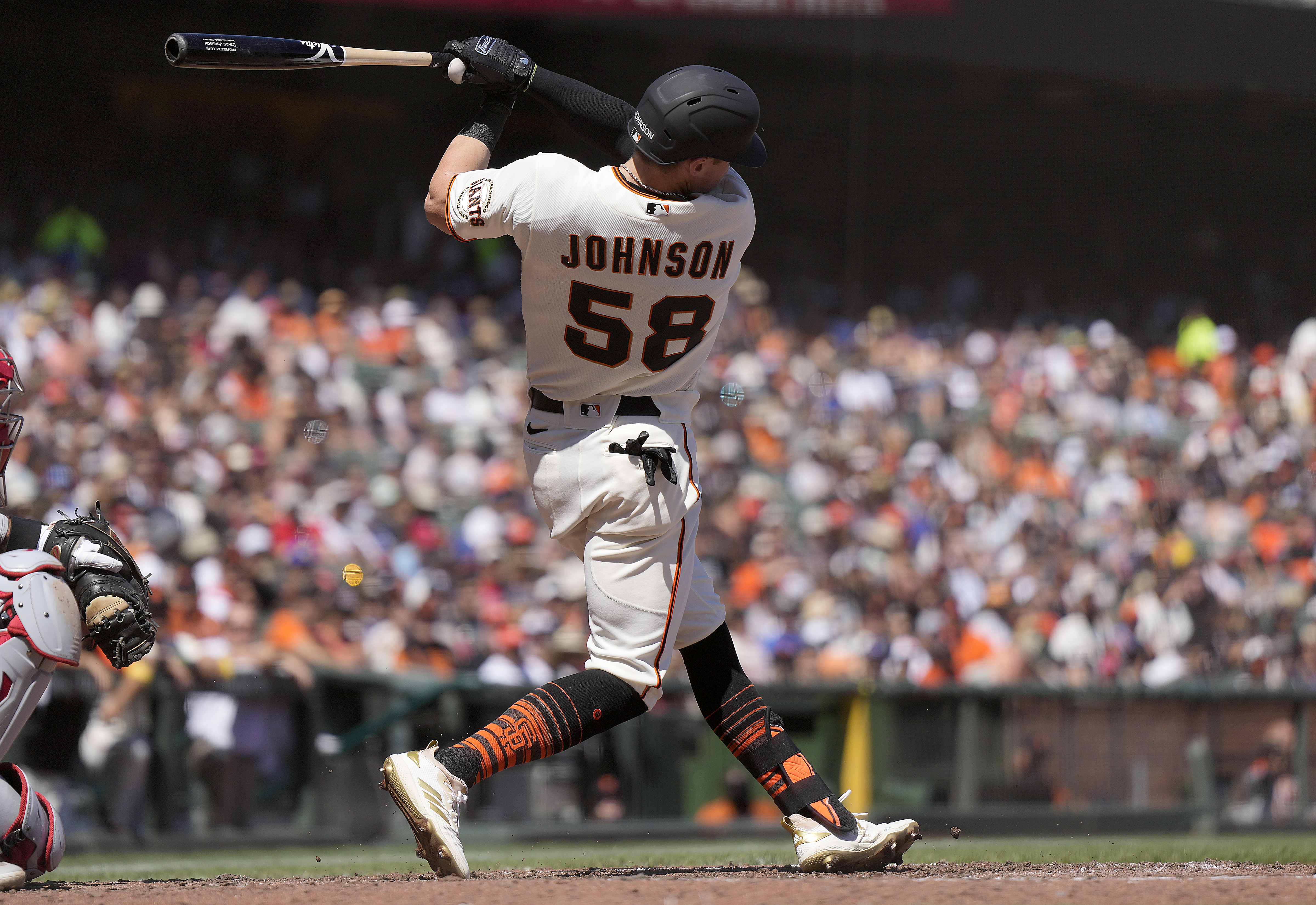Bryce Johnson finishing his swing in a home Giants jersey