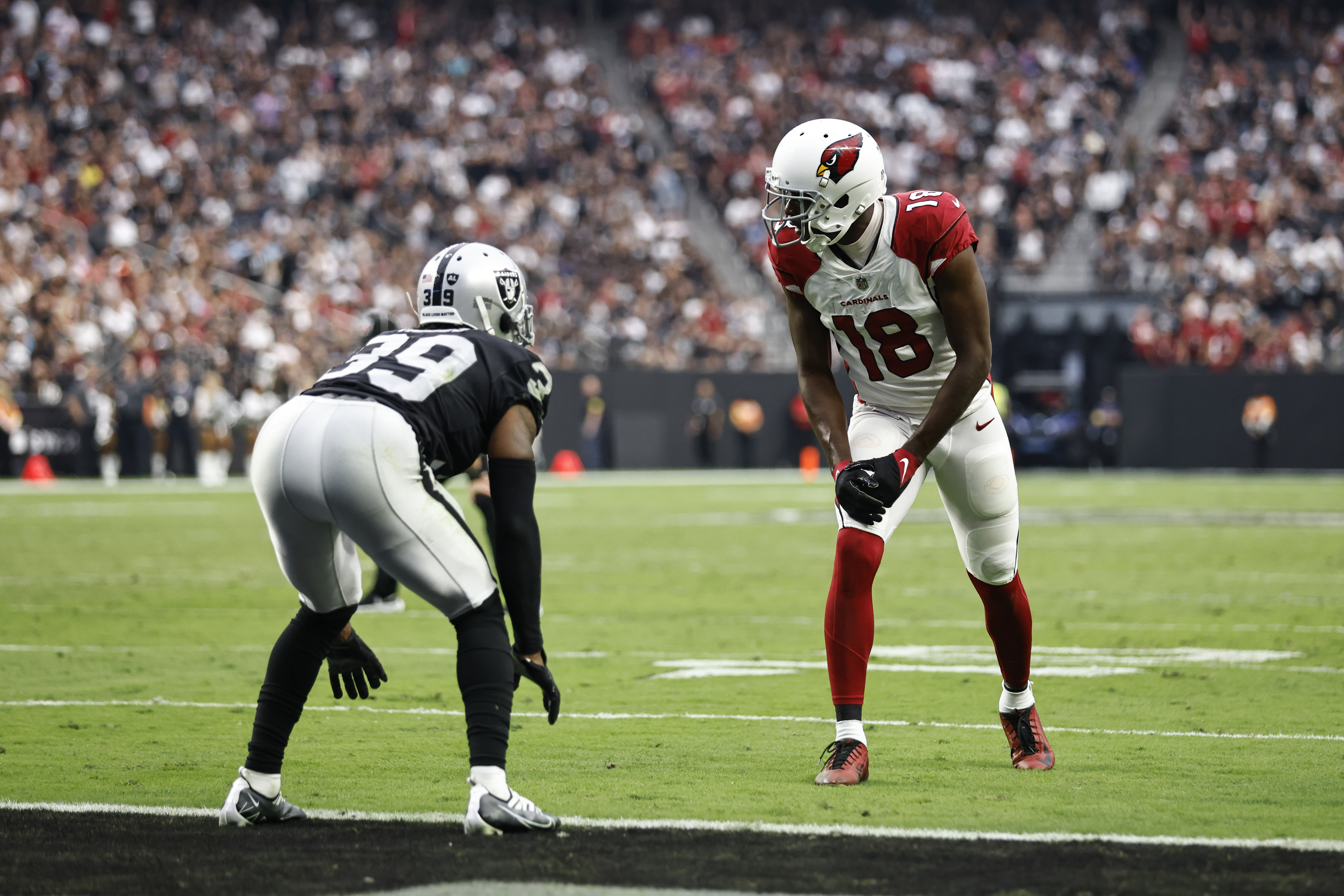 A.J. Green #18 of the Arizona Cardinals lines up against Nate Hobbs #39 of the Las Vegas Raiders during an NFL football game between the Las Vegas Raiders and the Arizona Cardinals at Allegiant Stadium on September 18, 2022 in Las Vegas, Nevada.