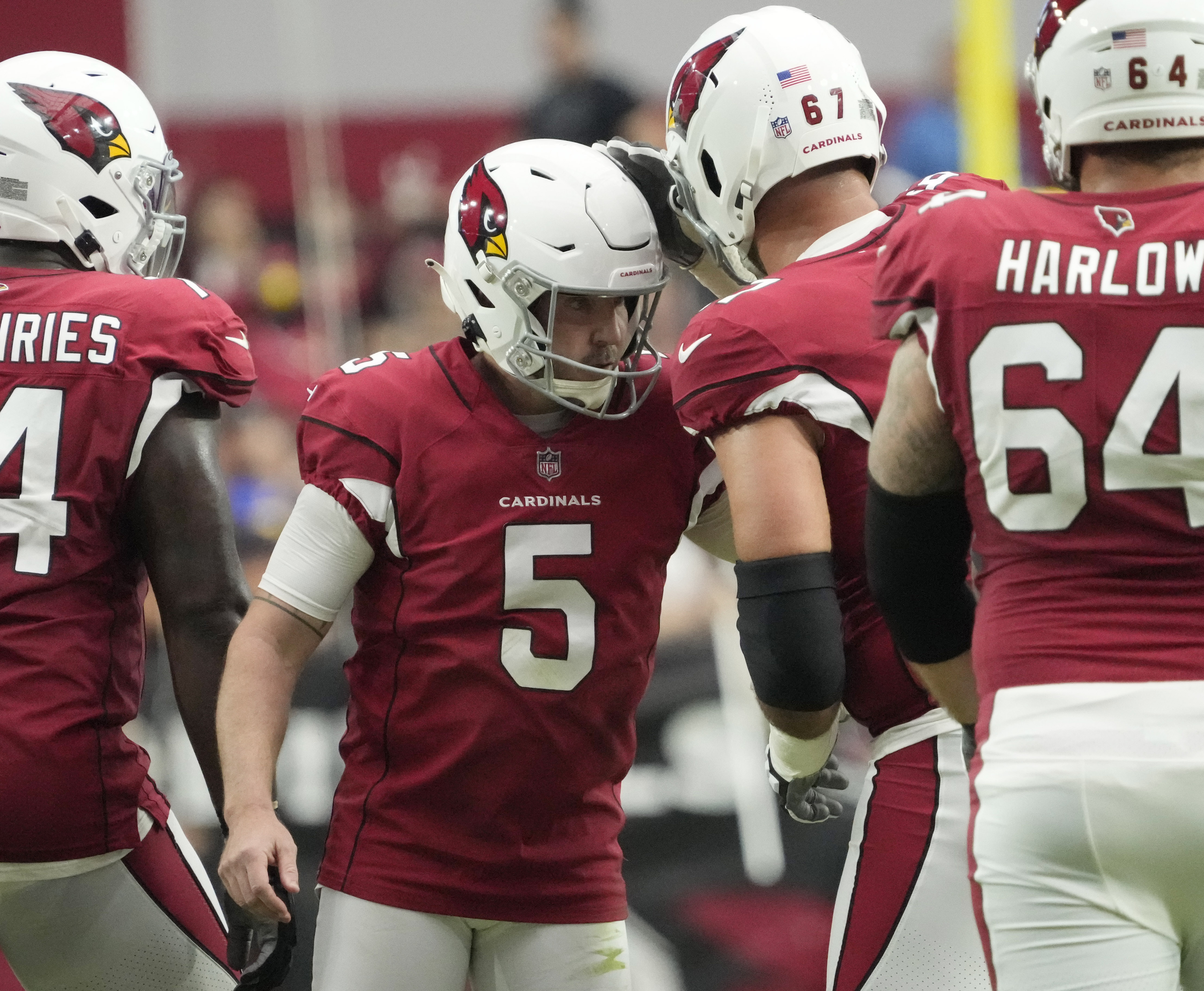Arizona Cardinals place kicker Matt Prater (5) is congratulated by guard Justin Pugh (67) after a filed goal against the Los Angeles Rams during the third quarter at State Farm Stadium.