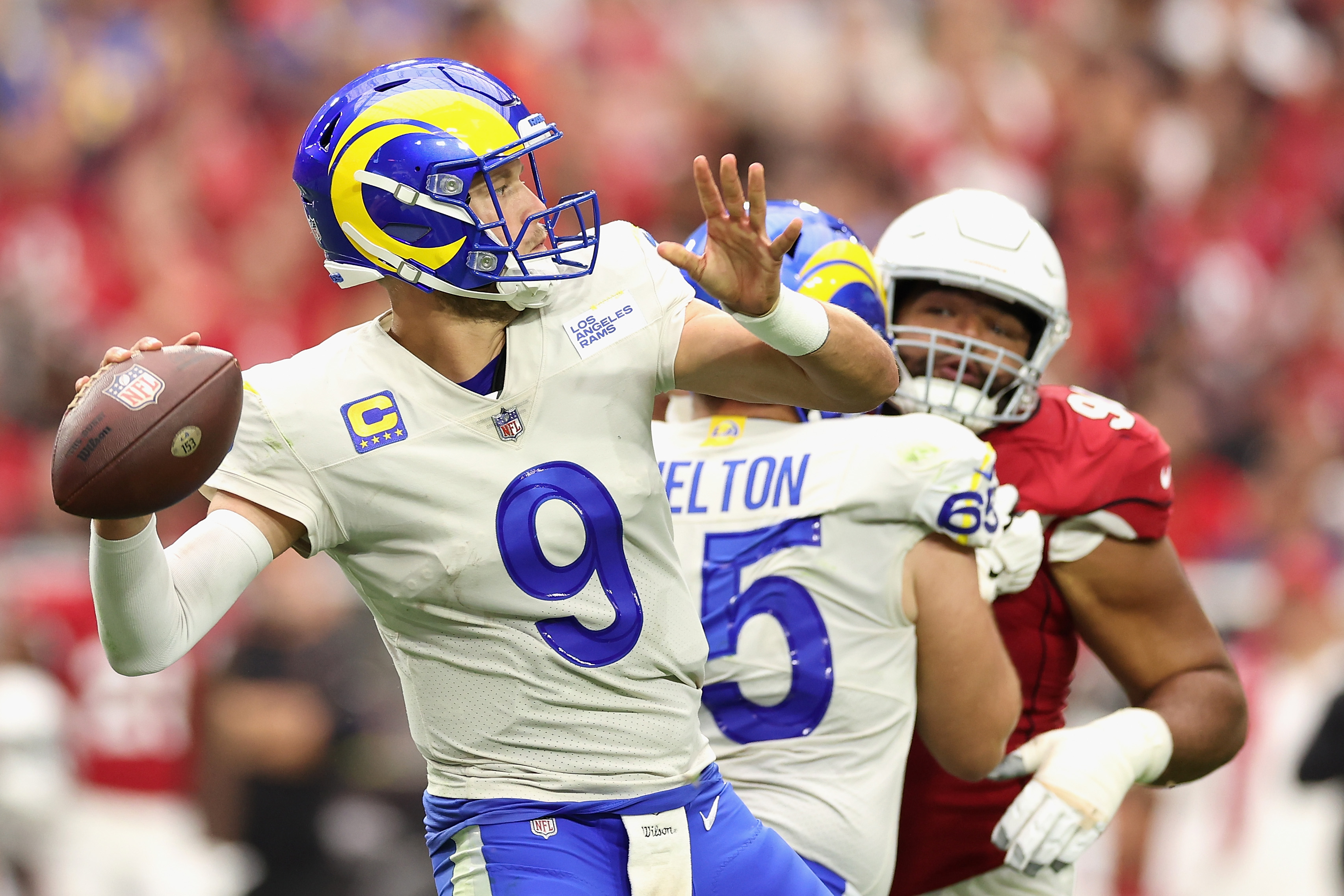 Quarterback Matthew Stafford #9 of the Los Angeles Rams throws a pass during the first half of the NFL game at State Farm Stadium on September 25, 2022 in Glendale, Arizona.
