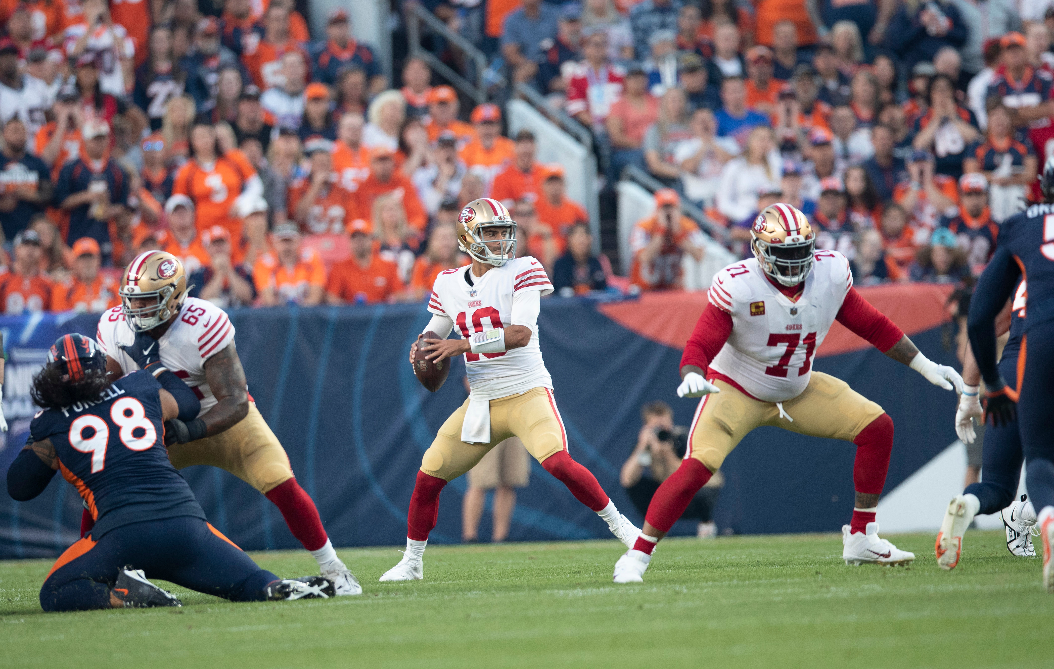 Jimmy Garoppolo #10 of the San Francisco 49ers passes during the game against the Denver Broncos at Empower Field At Mile High on September 25, 2022 in Denver, Colorado.
