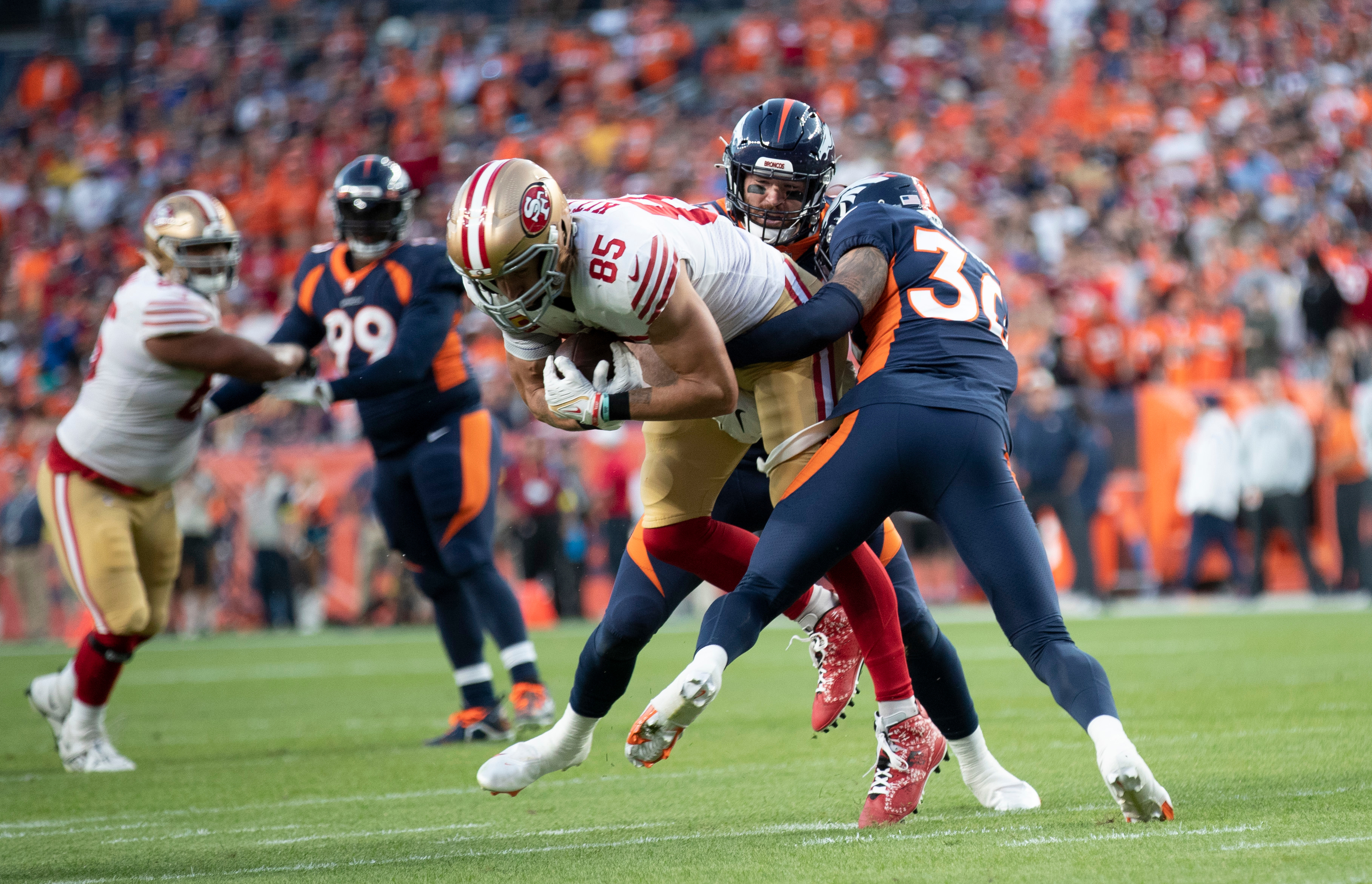 George Kittle #85 of the San Francisco 49ers makes a catch during the game against the Denver Broncos at Empower Field At Mile High on September 25, 2022 in Denver, Colorado.
