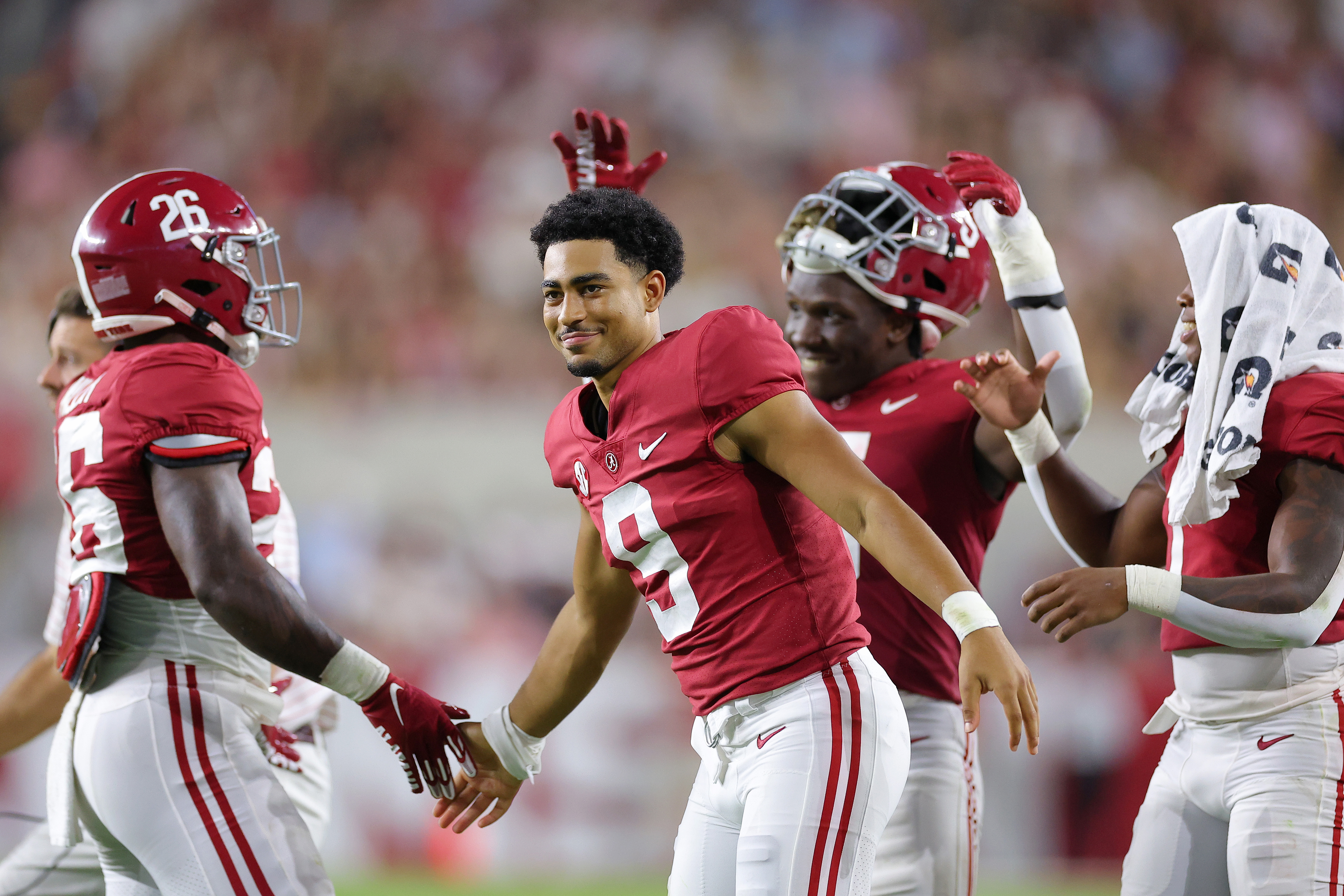Bryce Young of the Alabama Crimson Tide celebrates with teammate Jamarion Miller #26 after a touchdown during the second half of the game at Bryant-Denny Stadium on September 24, 2022 in Tuscaloosa, Alabama.