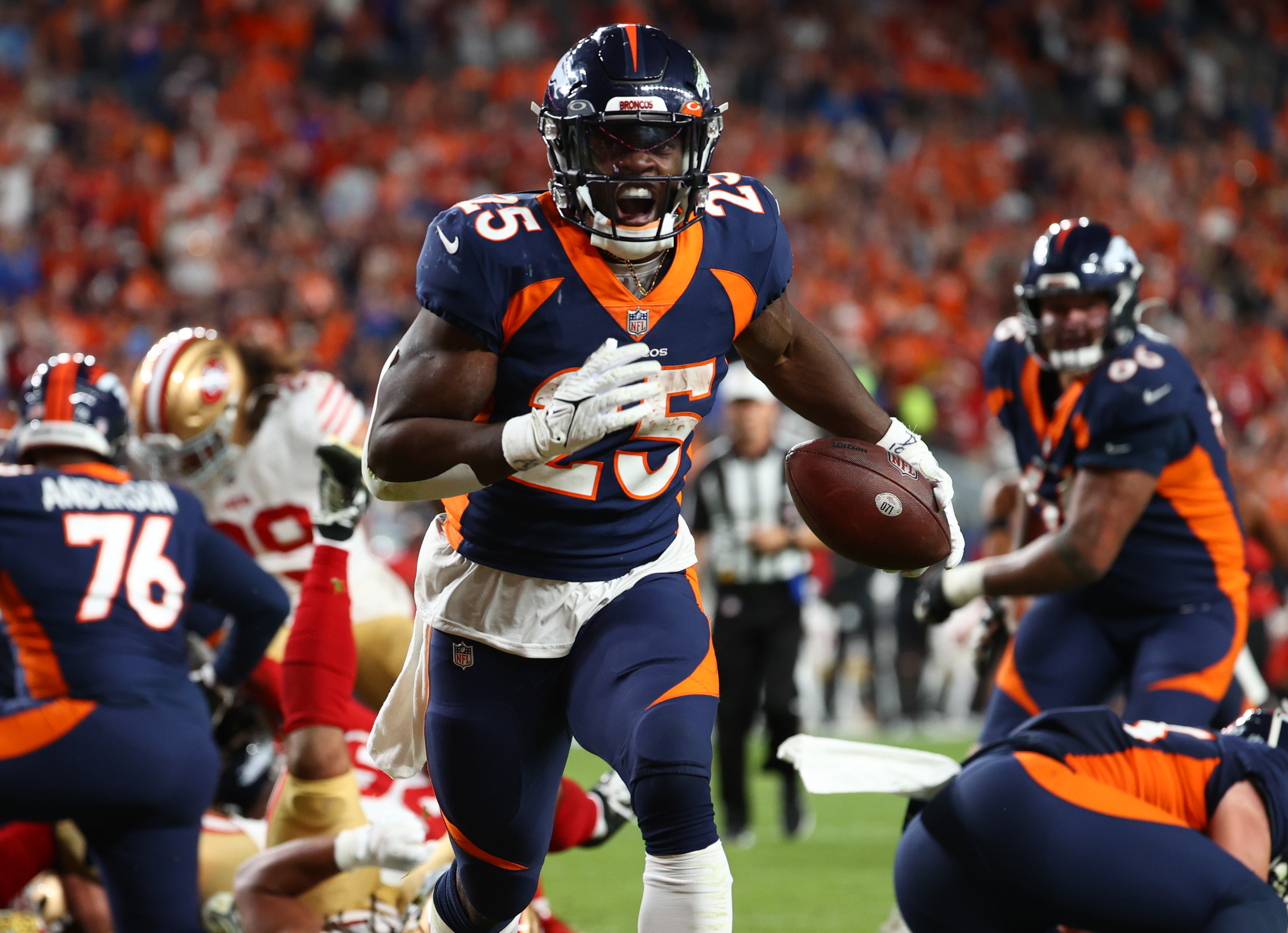 Melvin Gordon III #25 of the Denver Broncos rushes during the fourth quarter against the San Francisco 49ers at Empower Field At Mile High on September 25, 2022 in Denver, Colorado.
