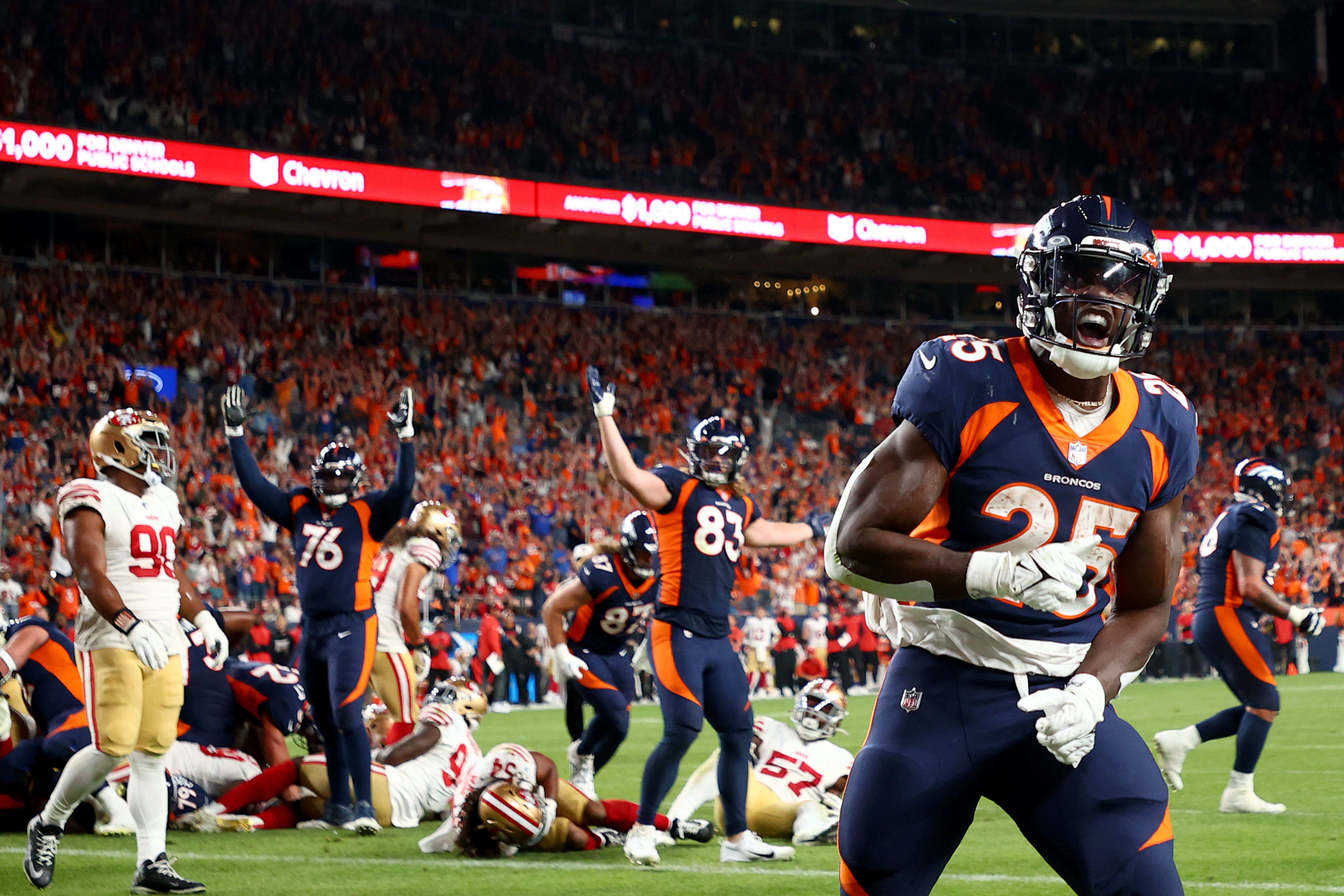 Melvin Gordon III #25 of the Denver Broncos celebrates a touchdown against the San Francisco 49ers at Empower Field At Mile High on September 25, 2022 in Denver, Colorado.