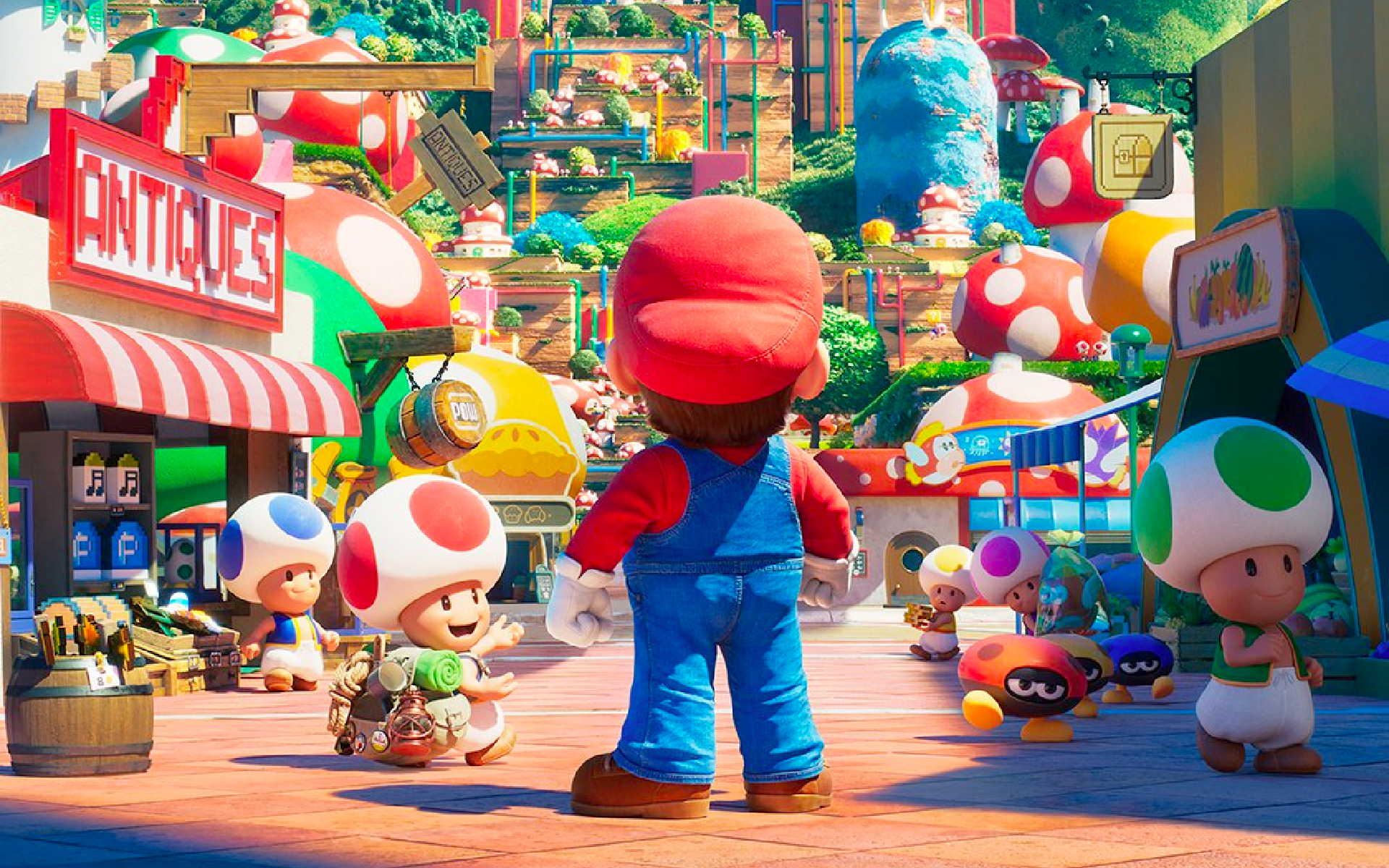 The back of Mario as he stands in a crowded shopping street populated by Toads in the Mushroom Kingdom