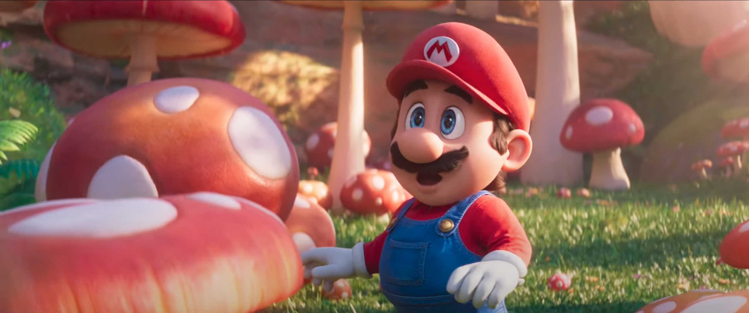 Mario (Italian)  stands in awe amongst the mushrooms (not Italian) surrounding him in The Super Mario Bros. Movie