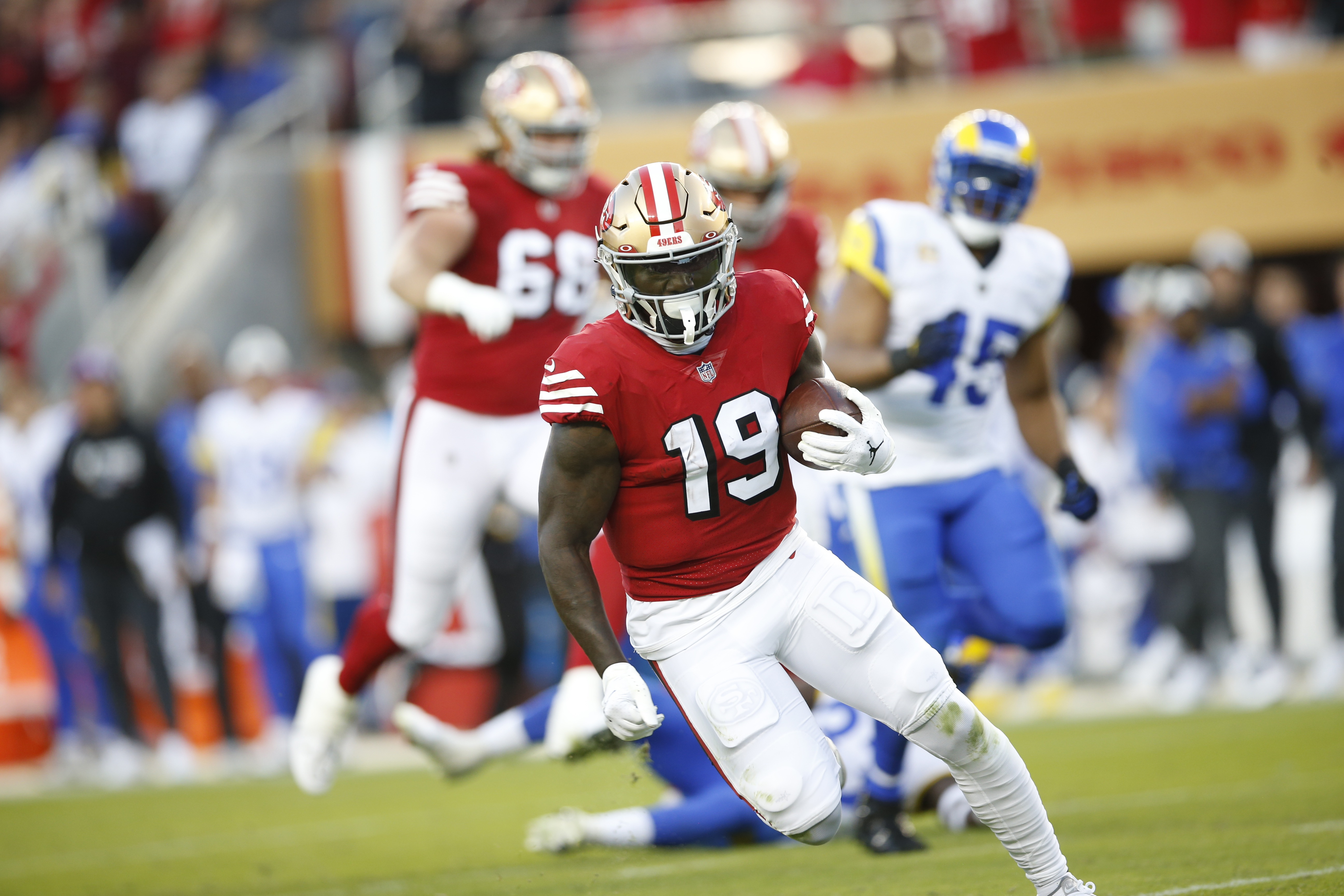 SANTA CLARA, CA - OCTOBER 3: Deebo Samuel #19 of the San Francisco 49ers heads to the end zone on a 57-yard touchdown catch during the game against the Los Angeles Rams at Levi’s Stadium on October 3, 2022 in Santa Clara, California. The 49ers defeated the Rams 24-9.