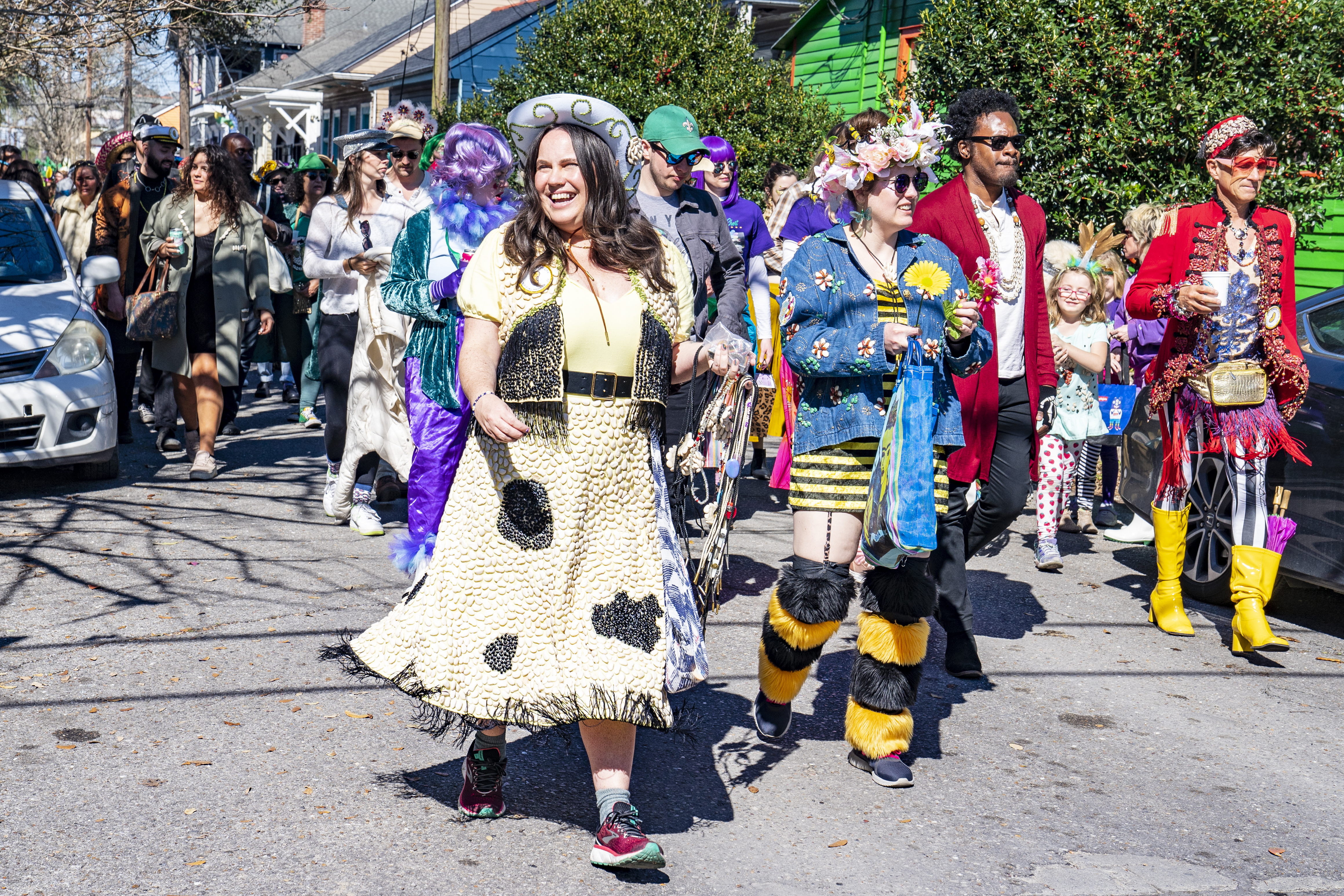 Costumed revelers participate in the Krewe of Red Beans parade through the Bywater on February 28, 2022 in New Orleans, Louisiana. The krewe uses beans to decorate homemade costumes for its second-line style walking parades