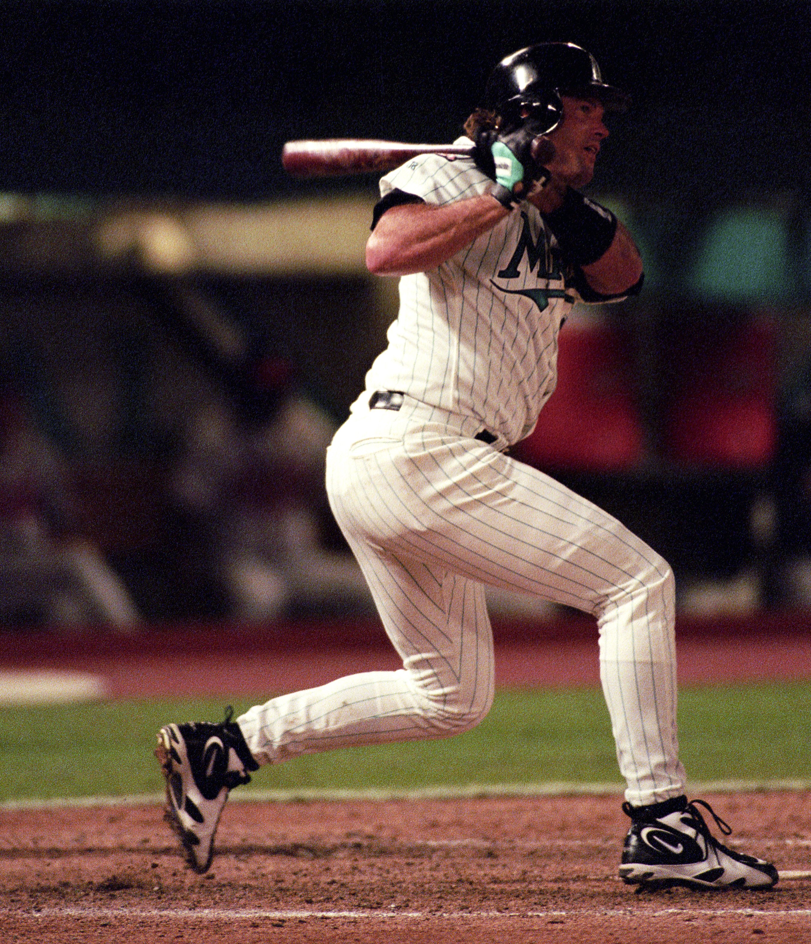 Darren Daulton #20 of the Florida Marlins batting against the Atlanta Braves during Game 3 of the National League Division Series on October 10, 1997 in Miami, Florida.