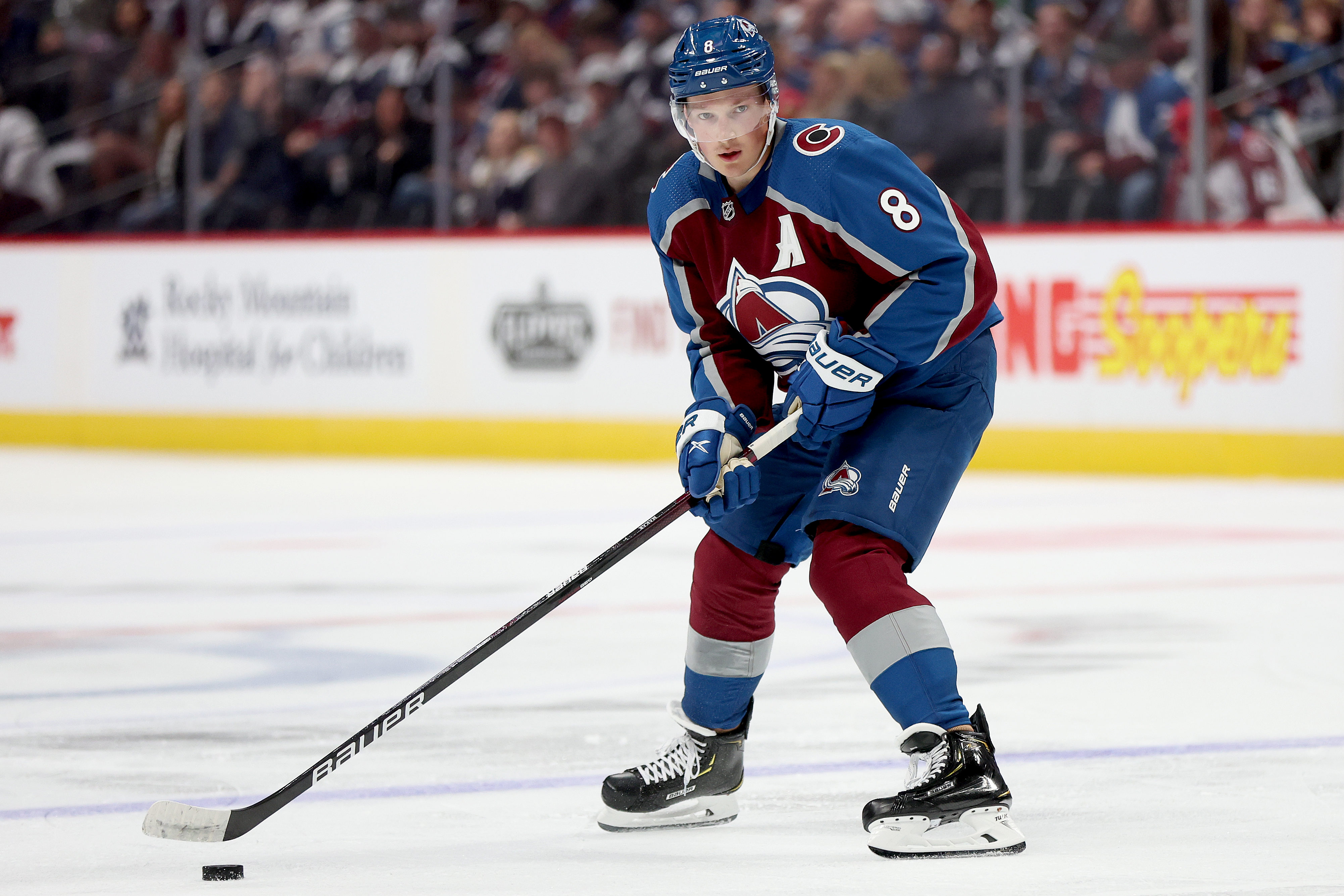 Cale Makar of the Colorado Avalanche looks for an opening against the Chicago Blackhawks during the second period at Ball Arena on October 12, 2022 in Denver, Colorado.
