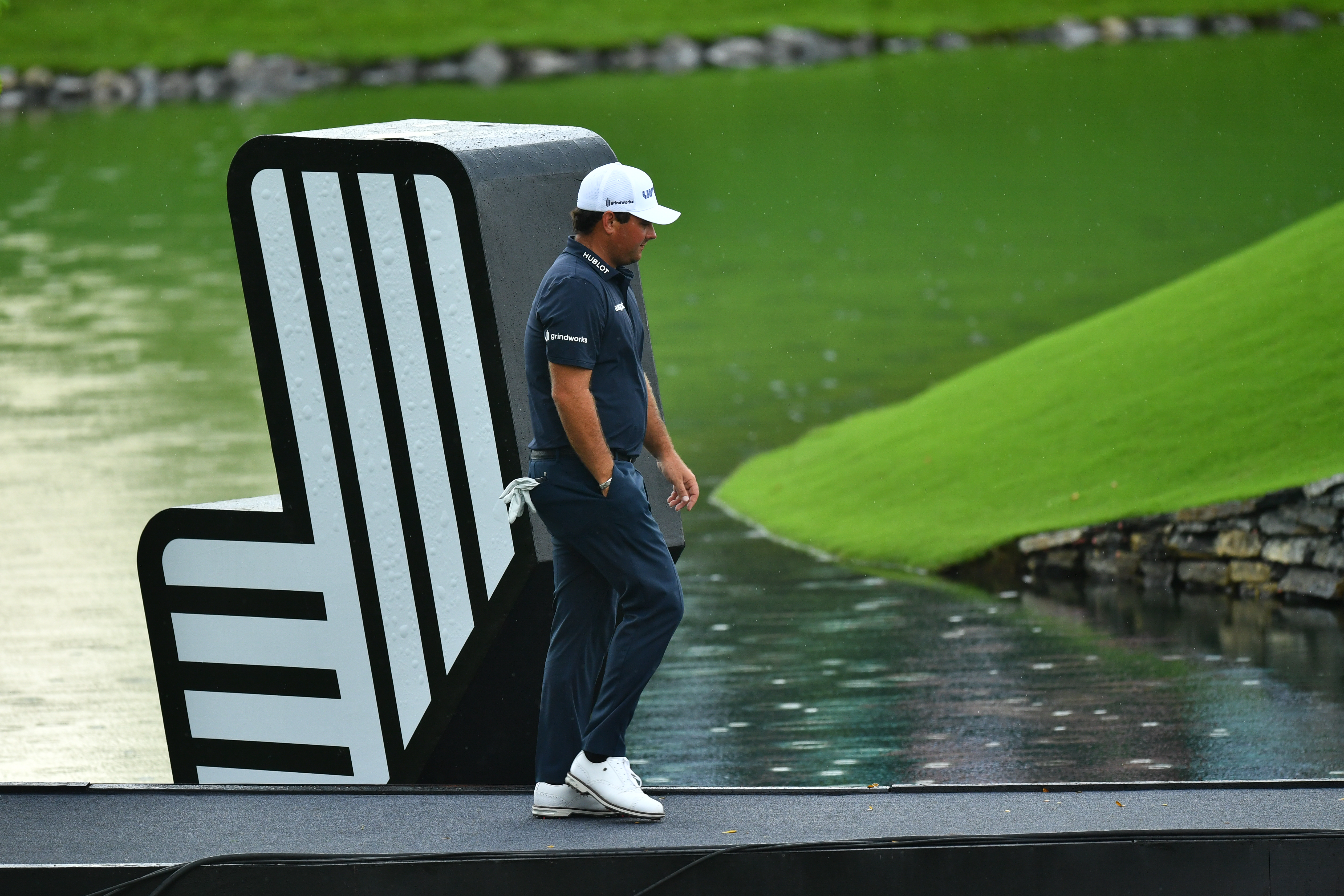 &nbsp;Patrick Reed of 4 Aces GC team walks over the bridge during the LIV Golf Invitational Bangkok final round at Stonehill Golf Course on October 9, 2022 in Pathum Thani, Thailand.