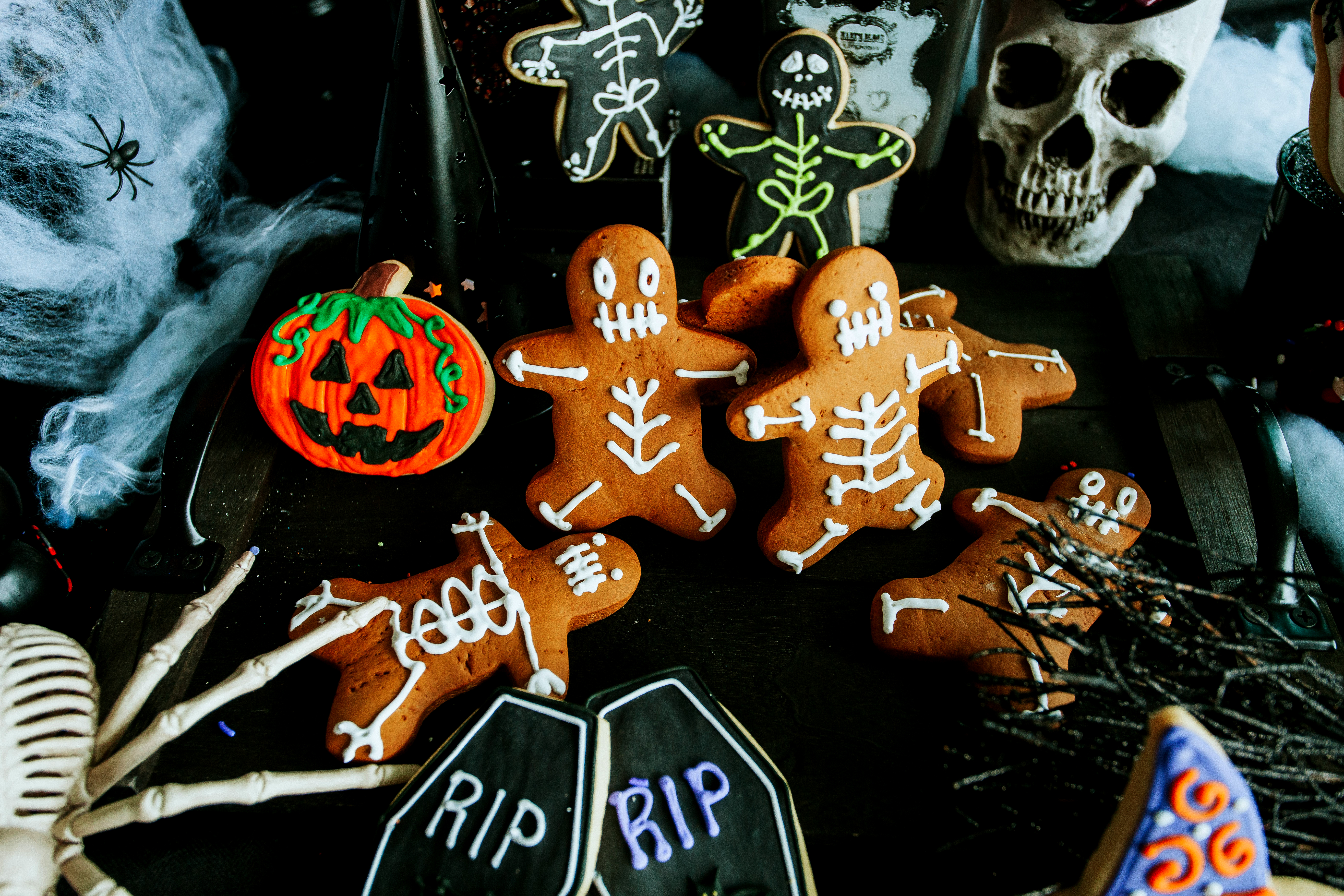 Dessert Gallery gingerbread cookies decorated like skeletons and butter cookies painted like tombstones and pumpkin.