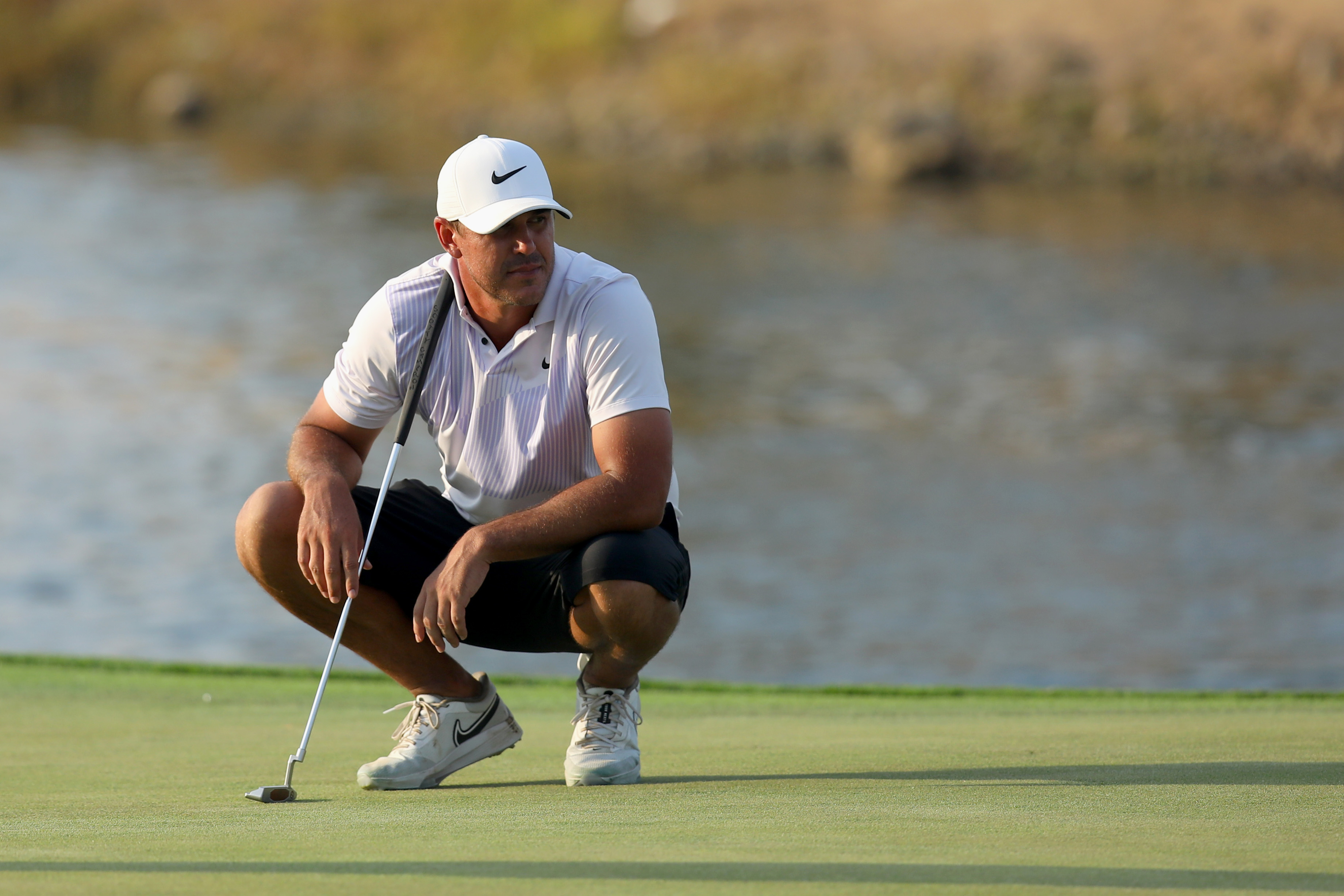 Team Captain Brooks Koepka of Smash GC waits to play his fourth shot on the 18th hole during day two of the LIV Golf Invitational - Jeddah at Royal Greens Golf &amp; Country Club on October 15, 2022 in King Abdullah Economic City, Saudi Arabia.