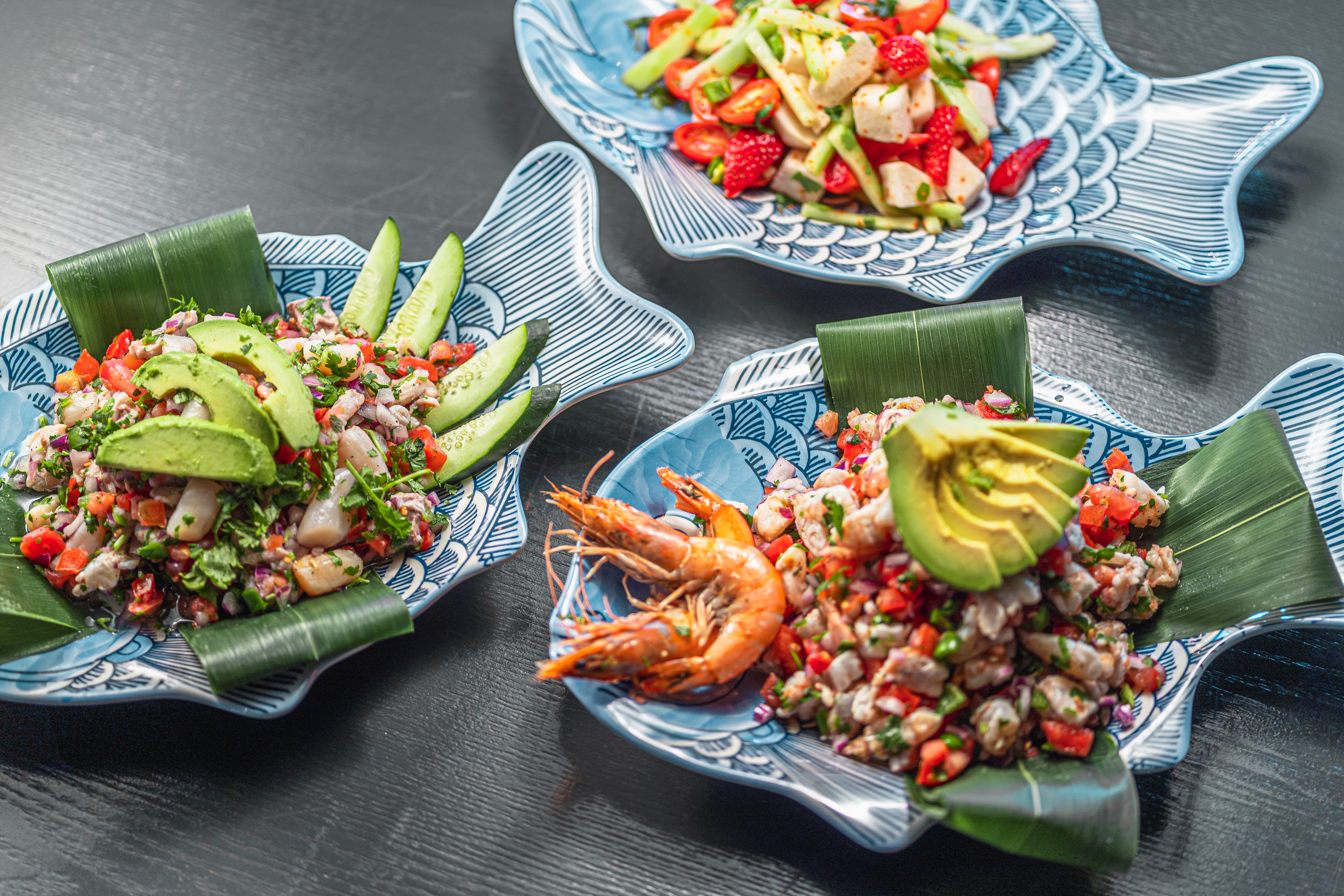 Three plates of Mexican ceviche.