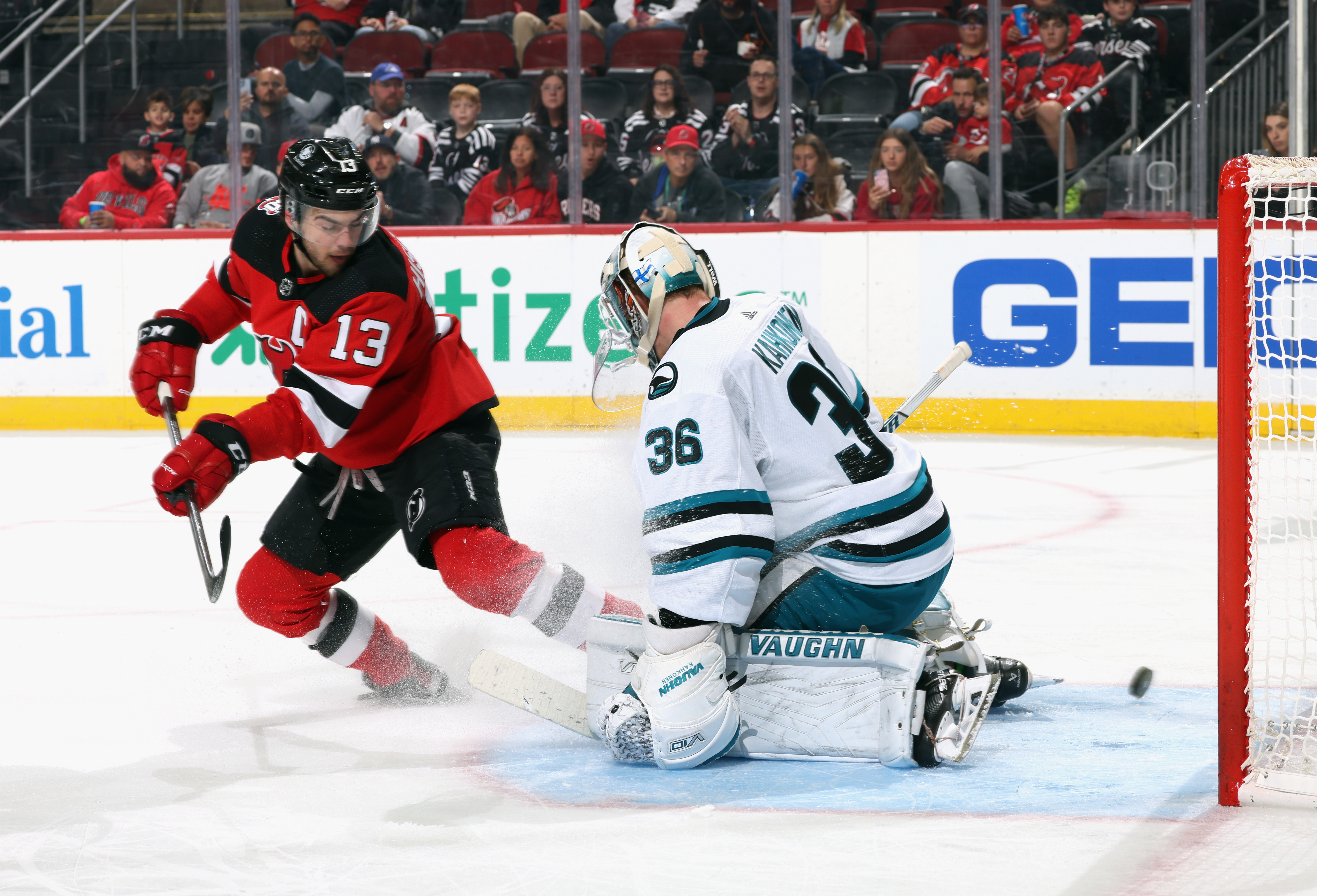 Nico Hischier #13 of the New Jersey Devils gets the puck past Kaapo Kahkonen #36 of the San Jose Sharks but the goal was disallowed during the second period for directing the puck with the skate at the Prudential Center on October 22, 2022 in Newark, New Jersey.