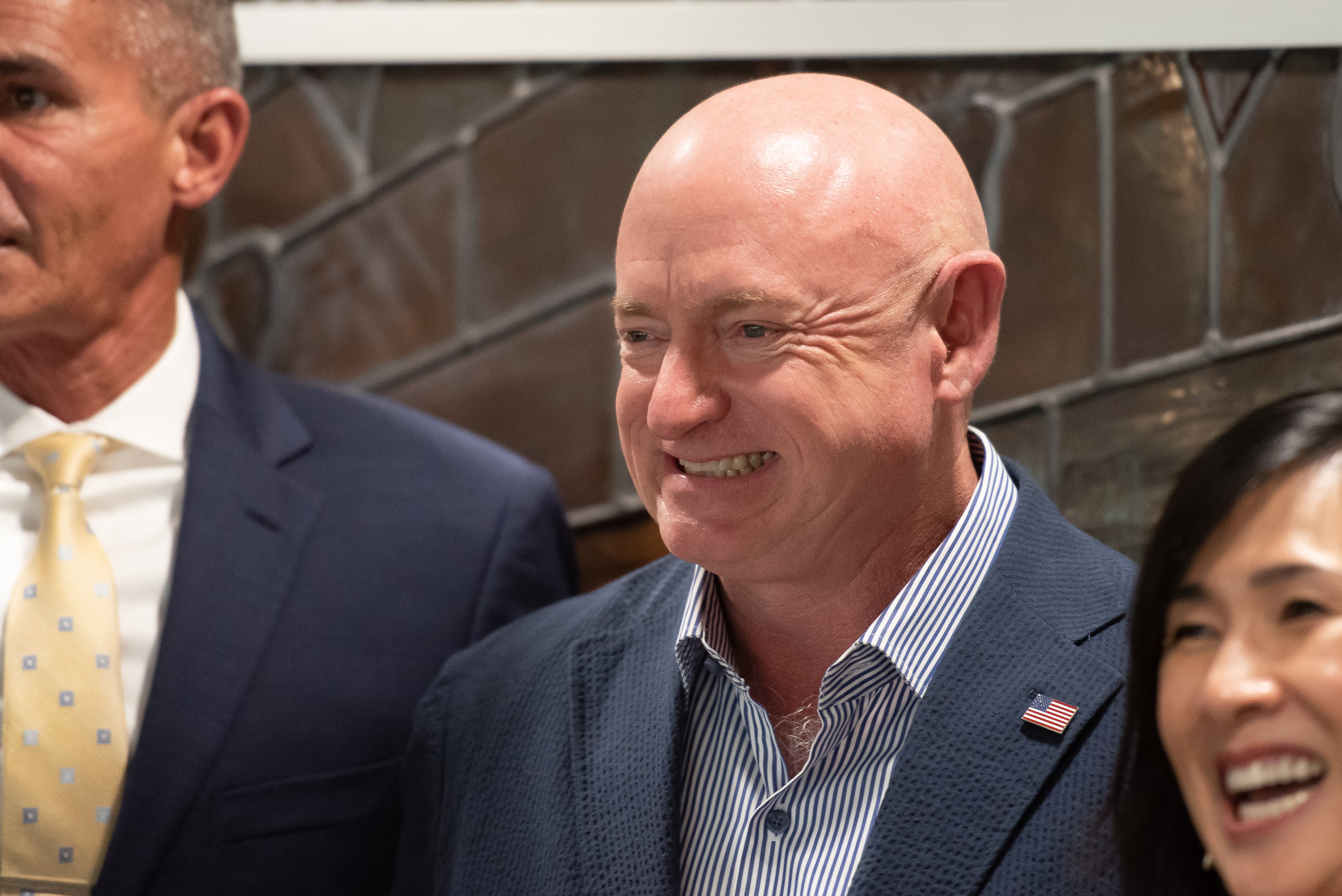 Sen. Mark Kelly (D-AZ) take a group photo at Handmaker Jewish Services for Aging on October 13, 2022 in Tucson, Arizona. Sen. Mark Kelly is campaigning for re-election against far-right, Trump-endorsed Republican candidate Blake Masters.