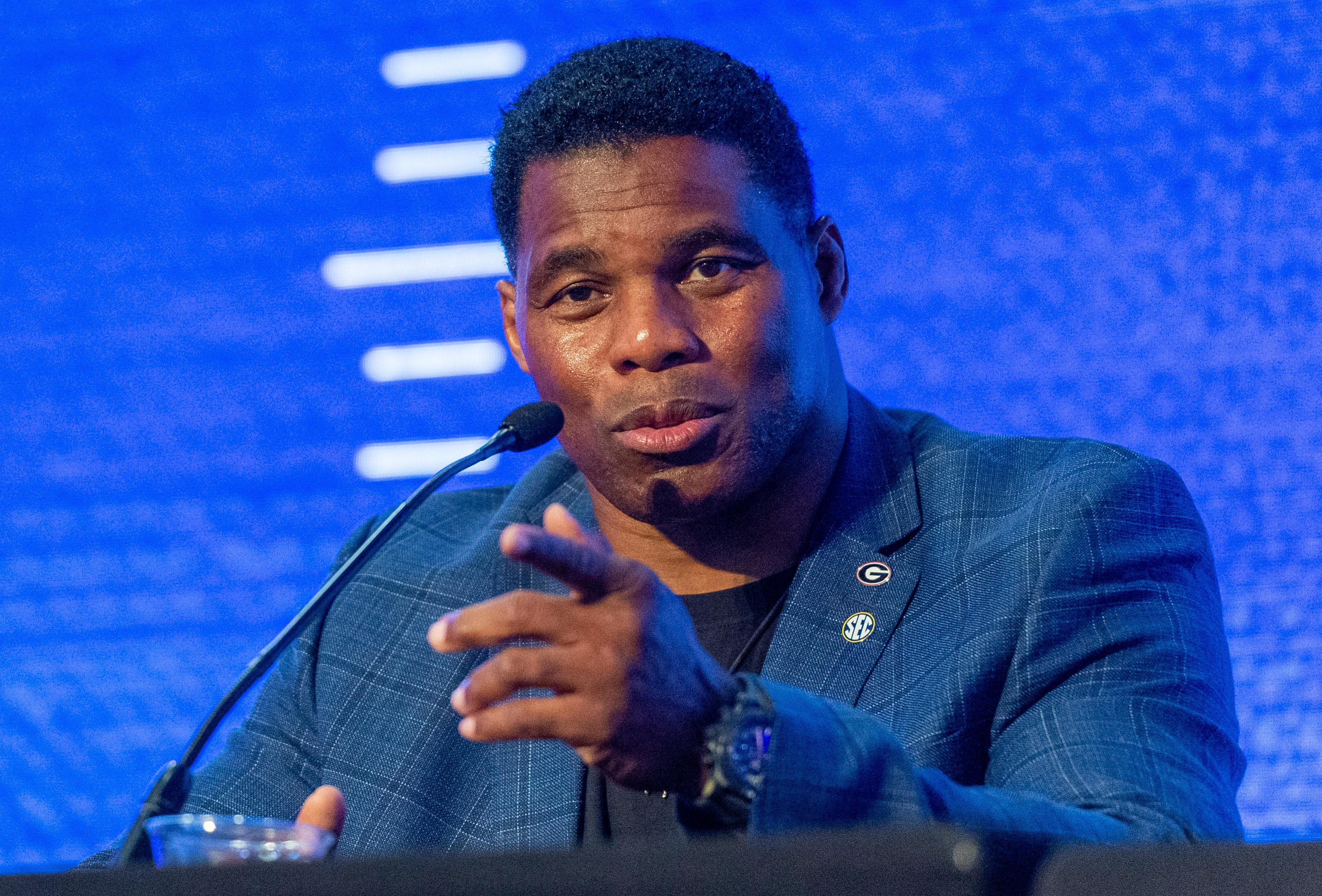 Herschel Walker speaks during the SEC Legends panel featuring Walker and Archie Manning and Steve Spurrier discussing 150 years of college football with the media at the Hyatt Regency-Birmingham.