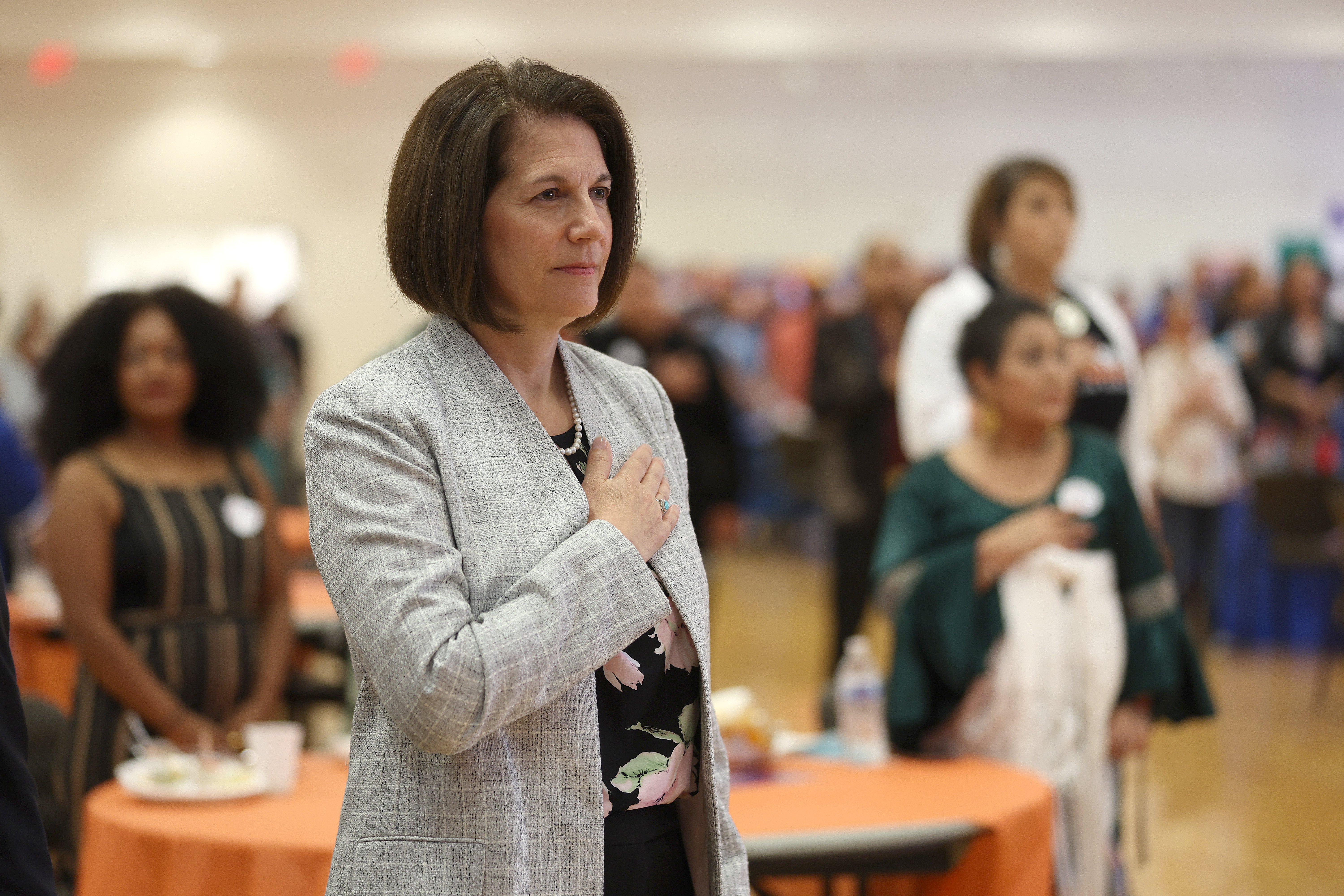U.S. Sen. Catherine Cortez Masto (D-NV) holds her hand over her heart as the National Anthem is sung during the La Gran Celebración Latina at East Las Vegas Community Center on October 16, 2022 in Las Vegas, Nevada.