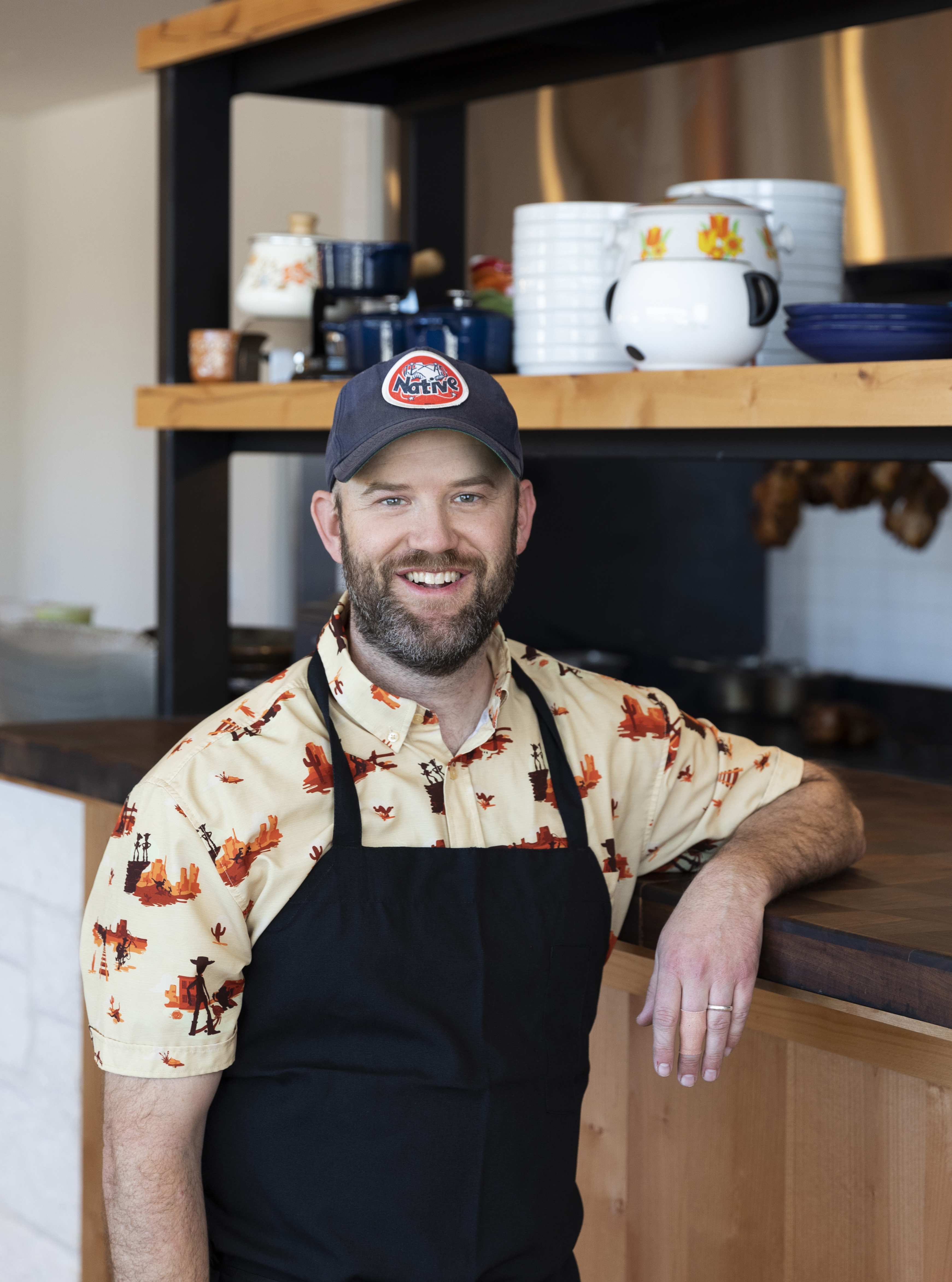 A headshot of chef Nick Fine in an apron.