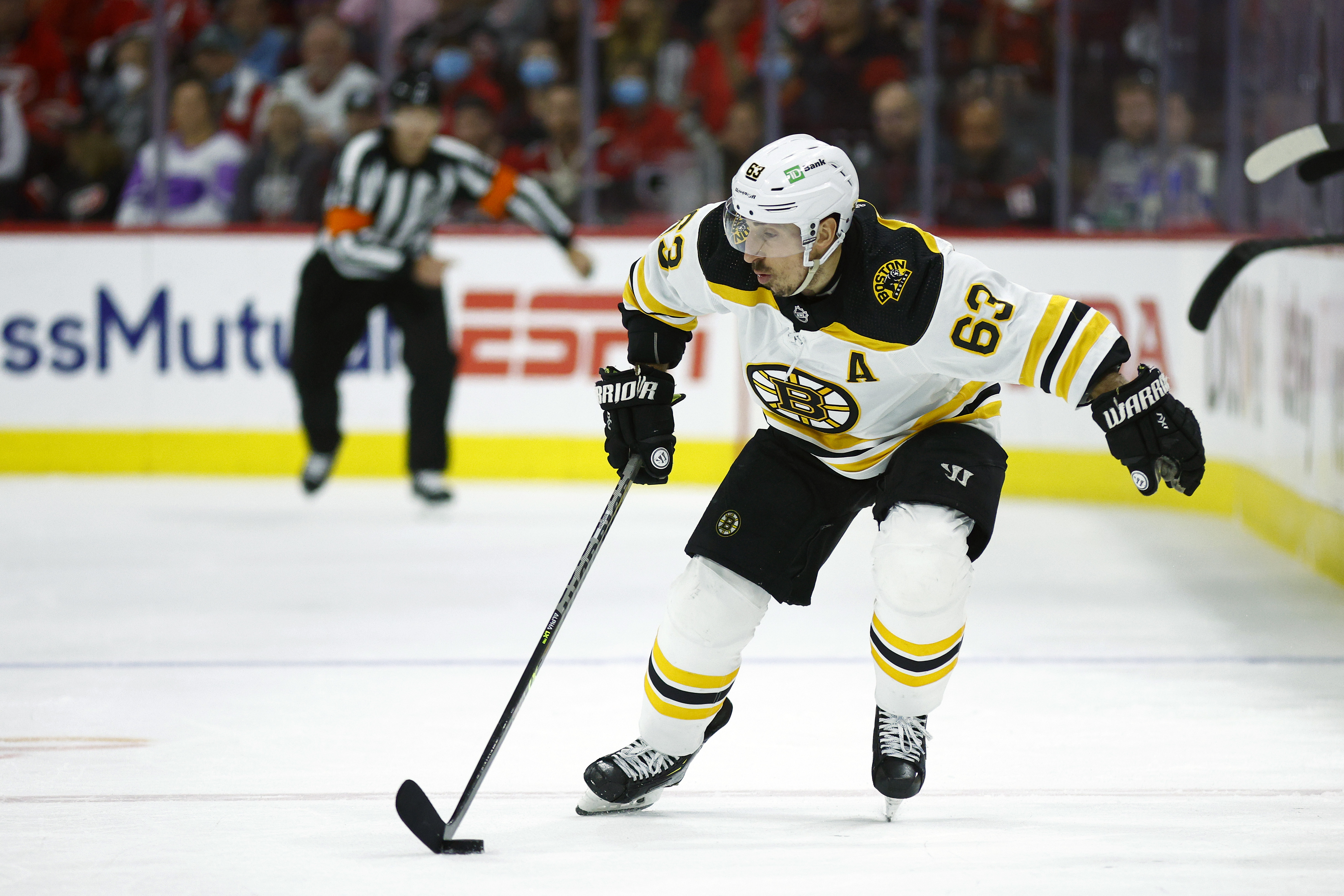 Brad Marchand of the Boston Bruins skates with the puck during the third period in Game Seven of the First Round of the 2022 Stanley Cup Playoffs against the Carolina Hurricanes at PNC Arena on May 14, 2022 in Raleigh, North Carolina.