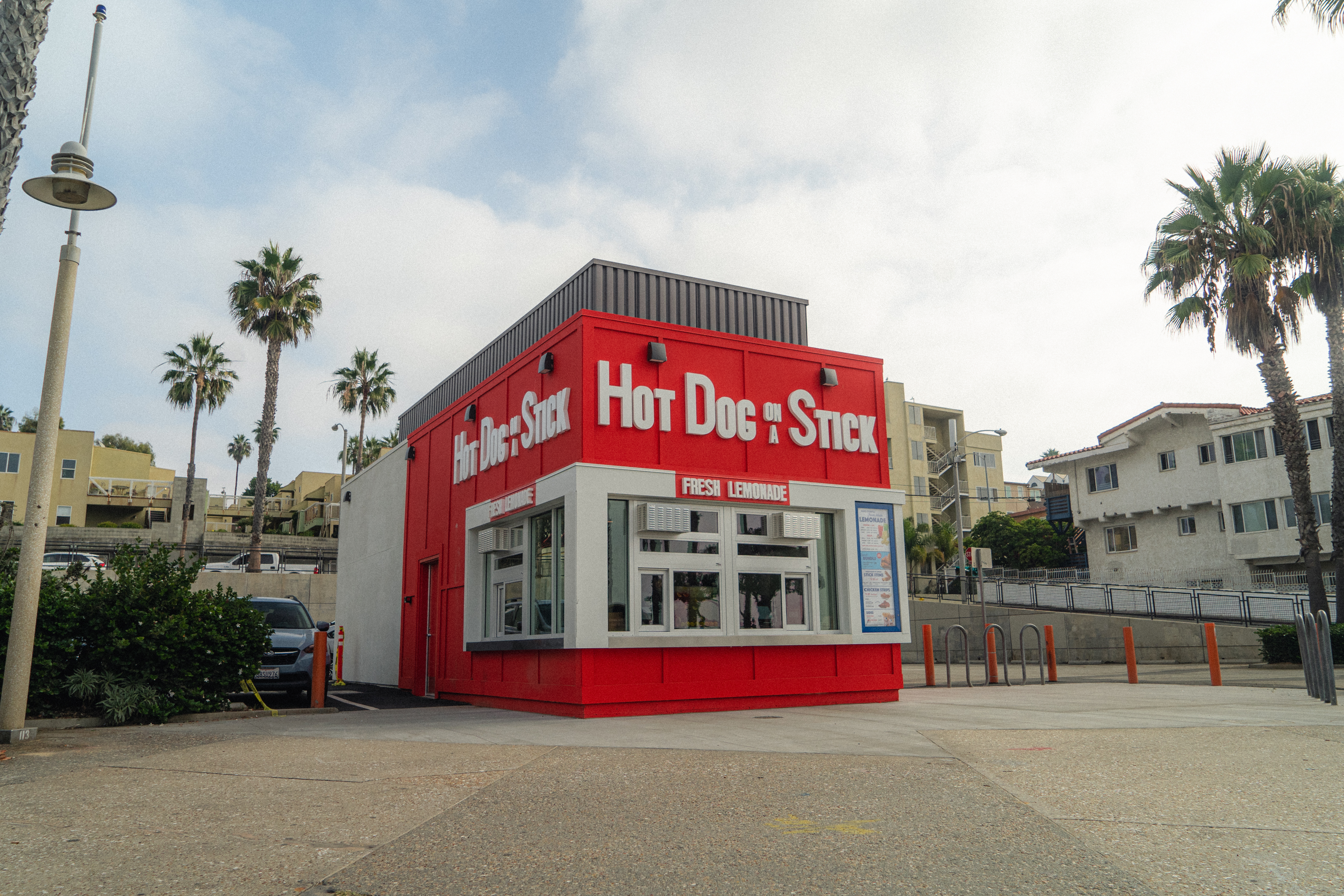 A red and white building for Hot Dog on a Stick in Santa Monica, California.