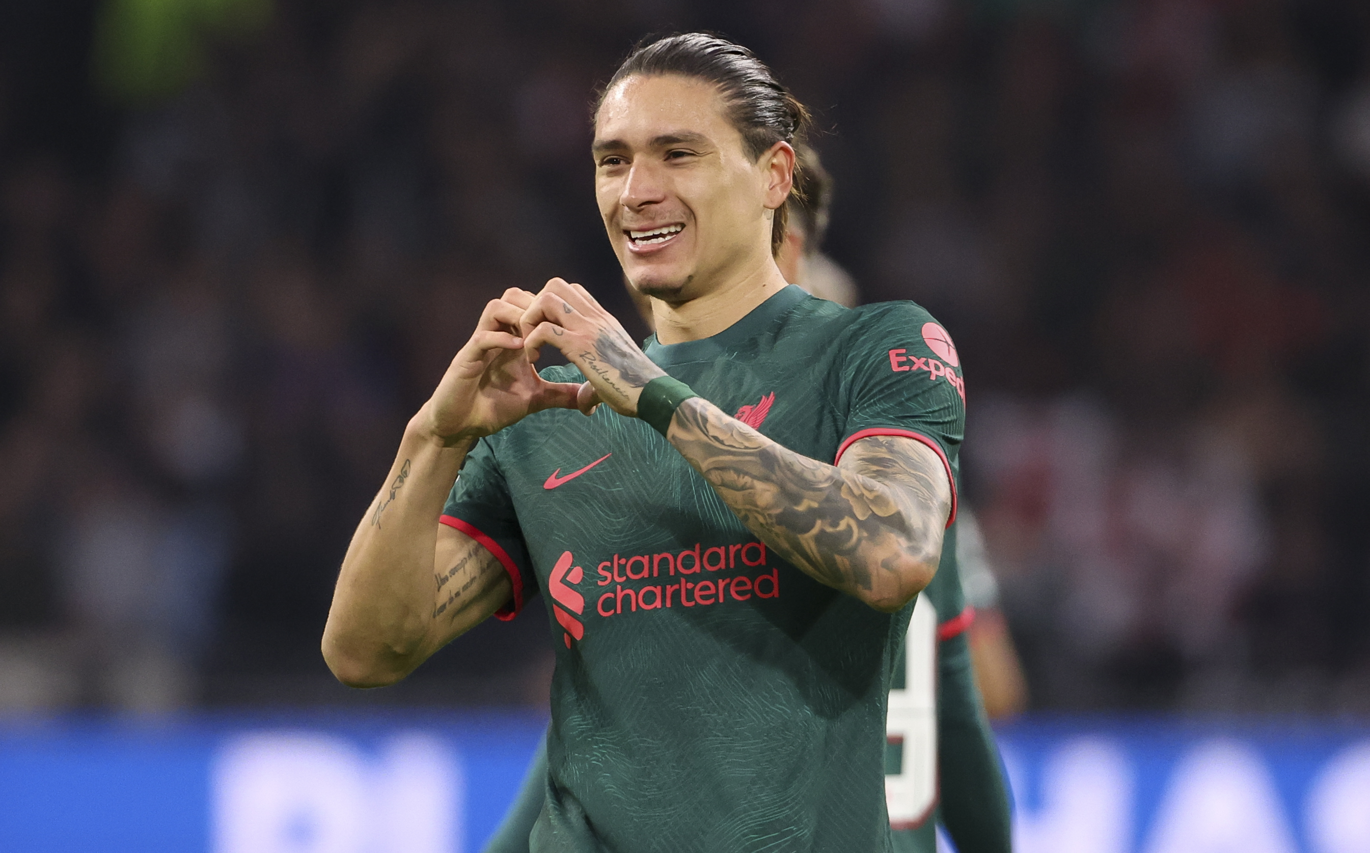 Darwin Nunez of Liverpool celebrates his goal with a heart hand gesture during the UEFA Champions League group A match between AFC Ajax Amsterdam and Liverpool FC at Johan Cruyff Arena (Johan Cruijff ArenA) on October 26, 2022 in Amsterdam, Netherlands.