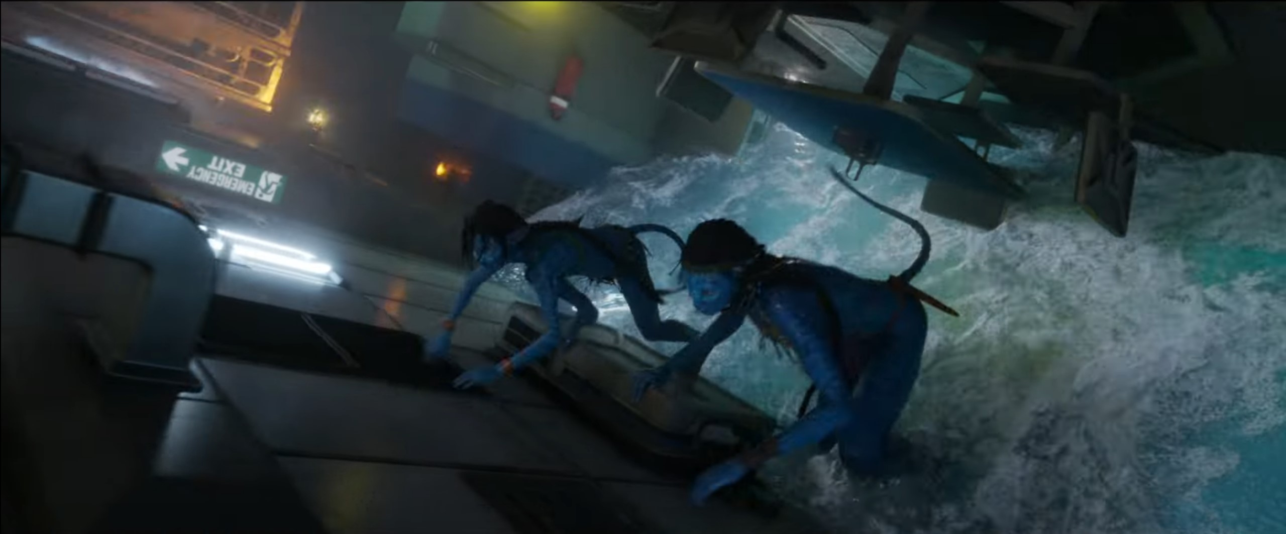 Two blue Navi run from rising water in a sinking structure in Avatar: The Way of Water