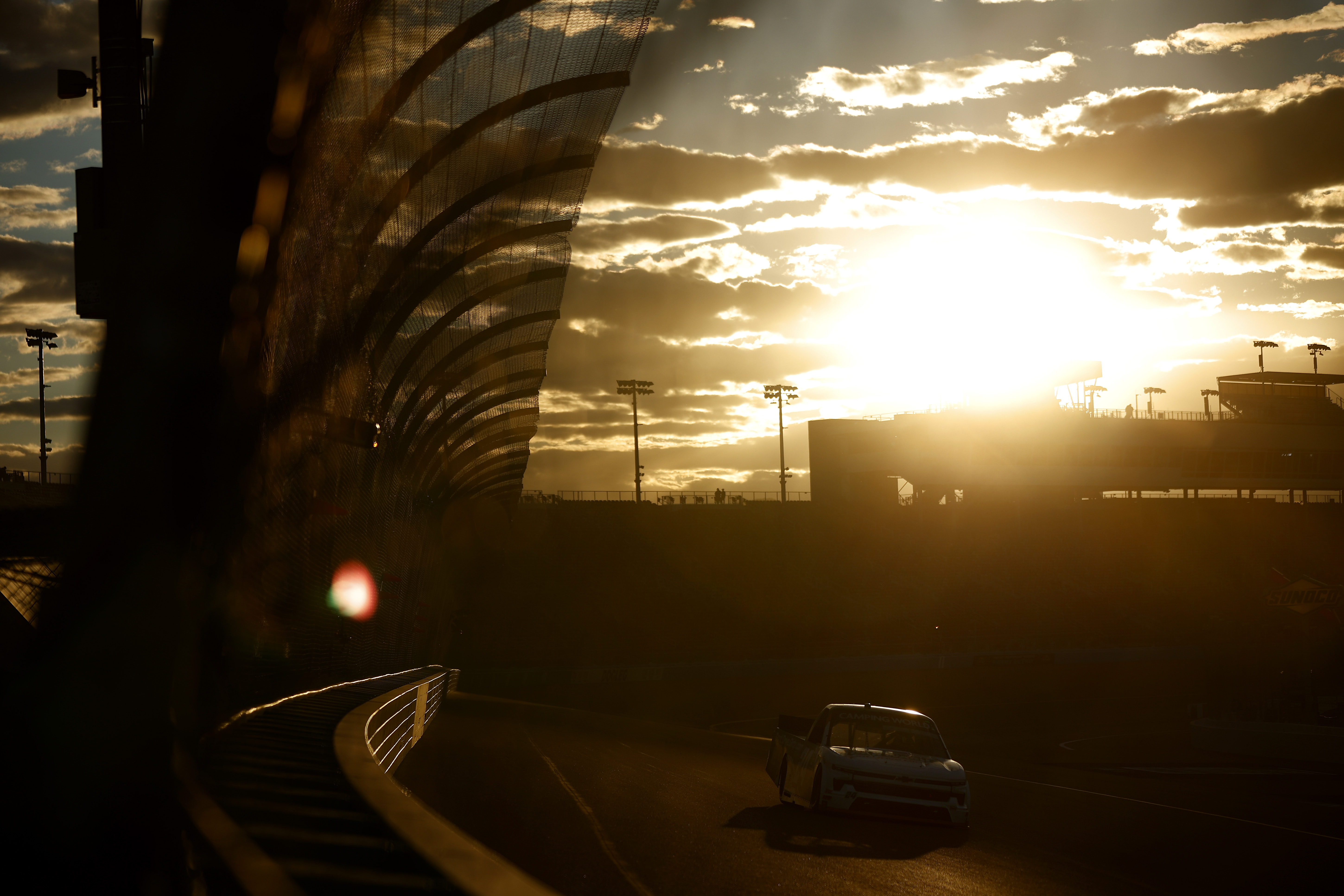 A general view of drivers as the sun sets during practice for the NASCAR Camping World Truck Series Lucas Oil 150 at Phoenix Raceway on November 03, 2022 in Avondale, Arizona.
