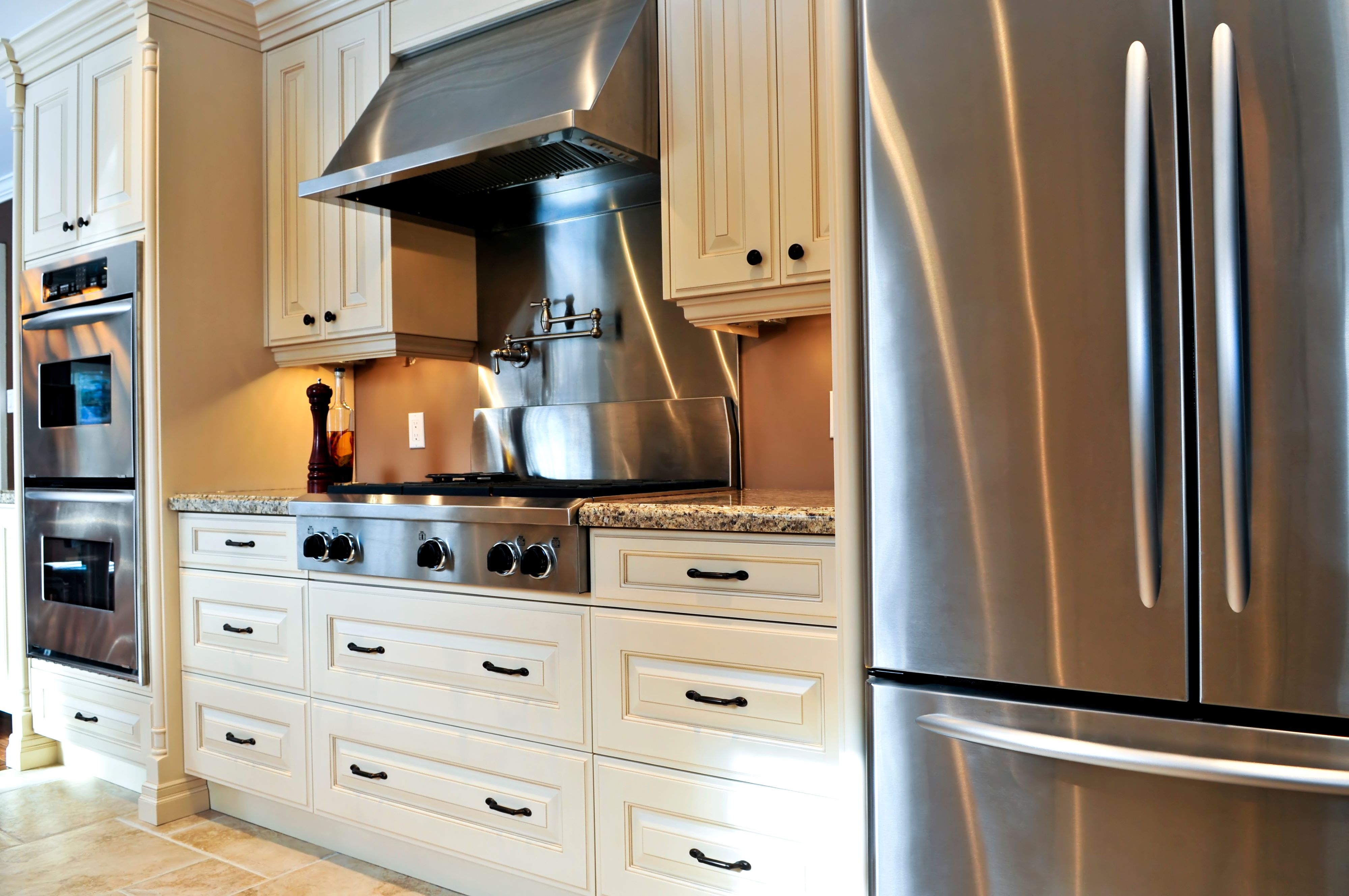 a range hood over a stove in a kitchen