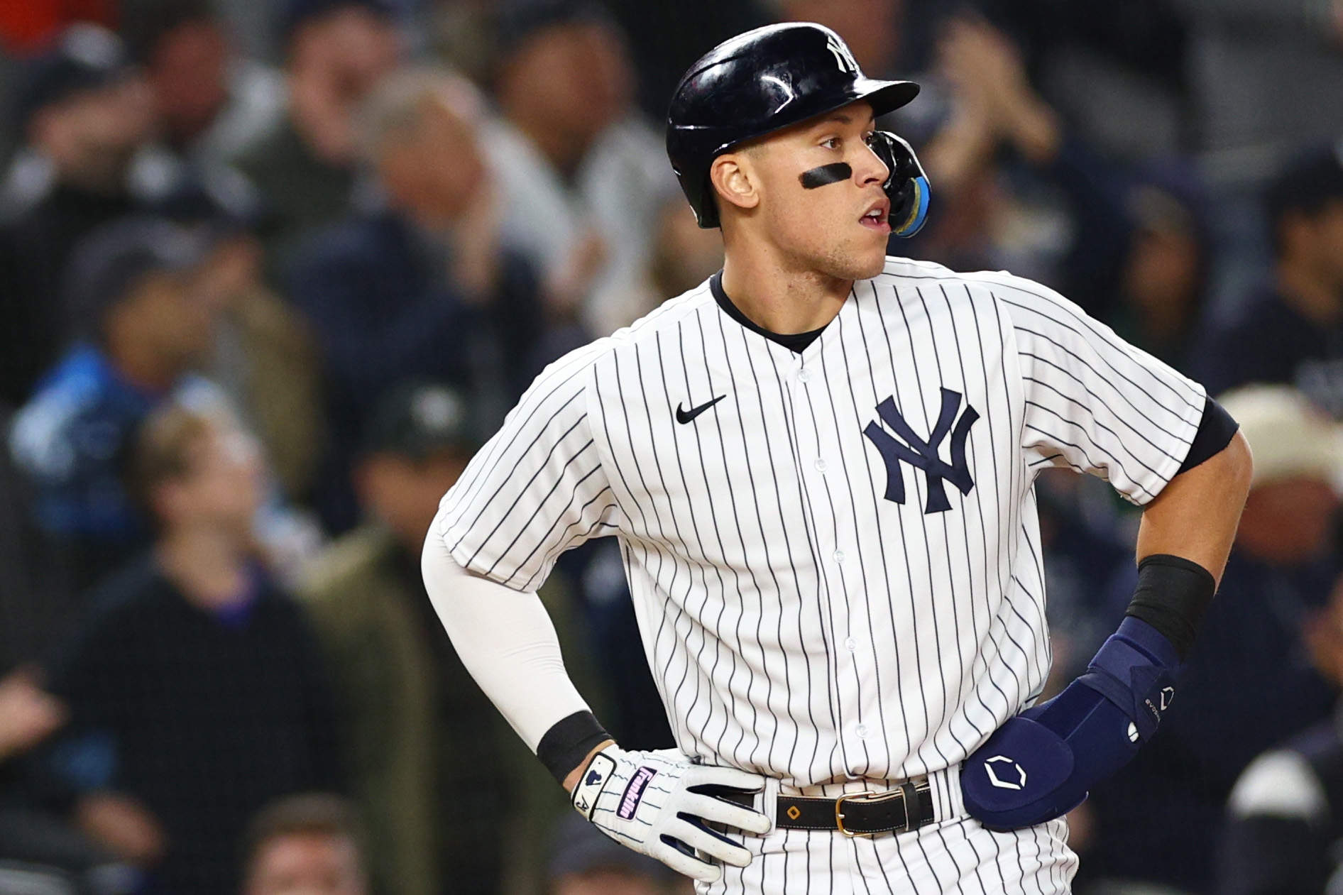 Aaron Judge #99 of the New York Yankees looks on after reaching third base in the second inning against the Houston Astros in game four of the American League Championship Series at Yankee Stadium on October 23, 2022 in the Bronx borough of New York City.