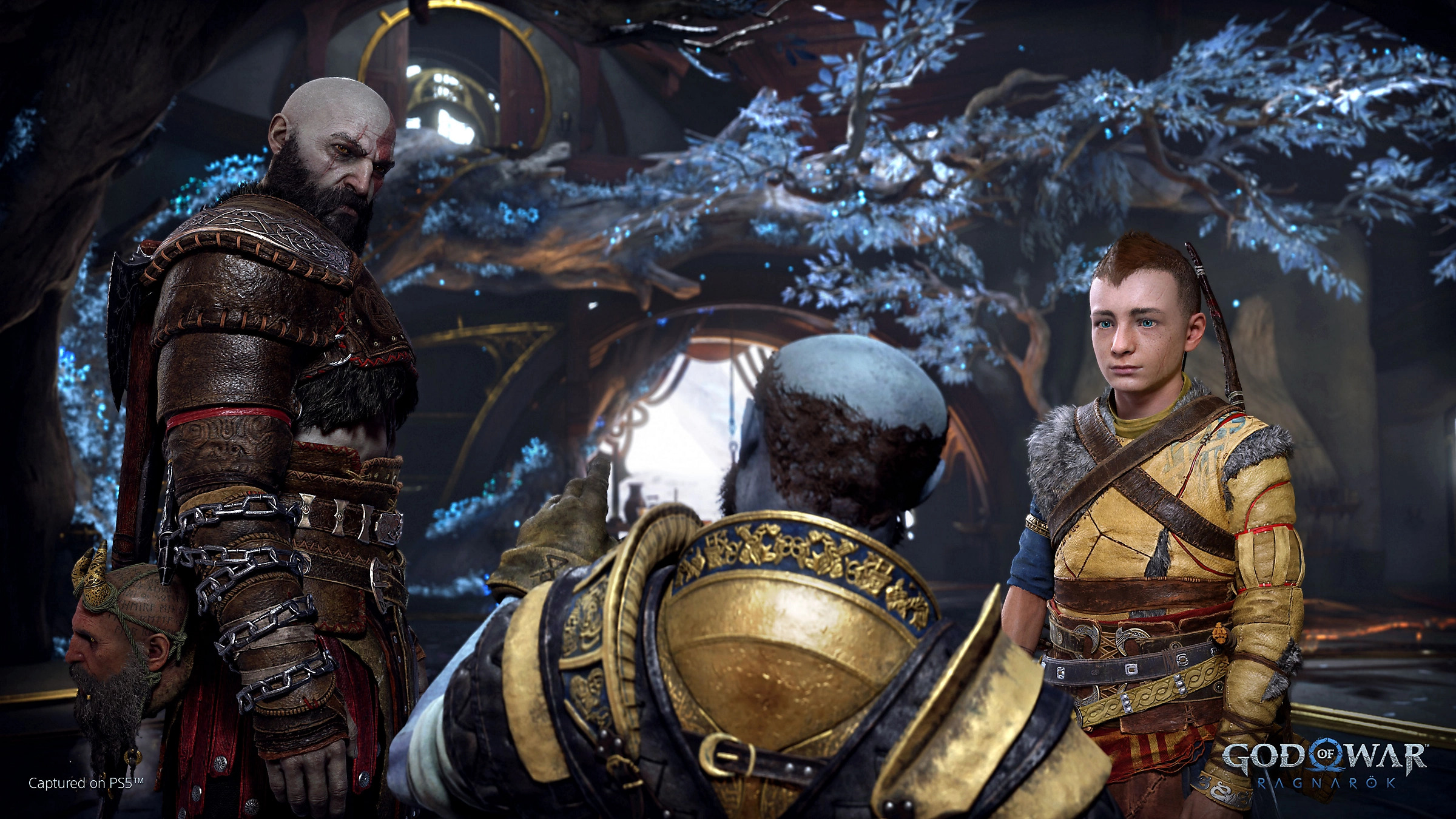 Brok, a blue dwarf, speaks to Kratos and Atreus in God of War: Ragnarök